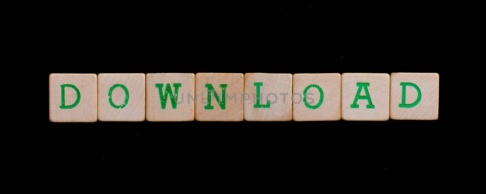 Green letters on old wooden blocks (download)
