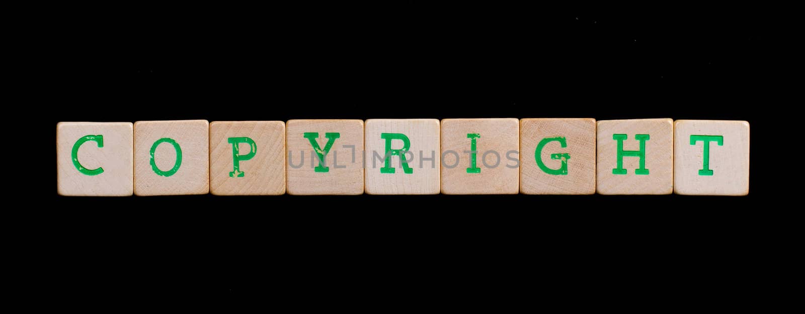Green letters on old wooden blocks (copyright) by michaklootwijk