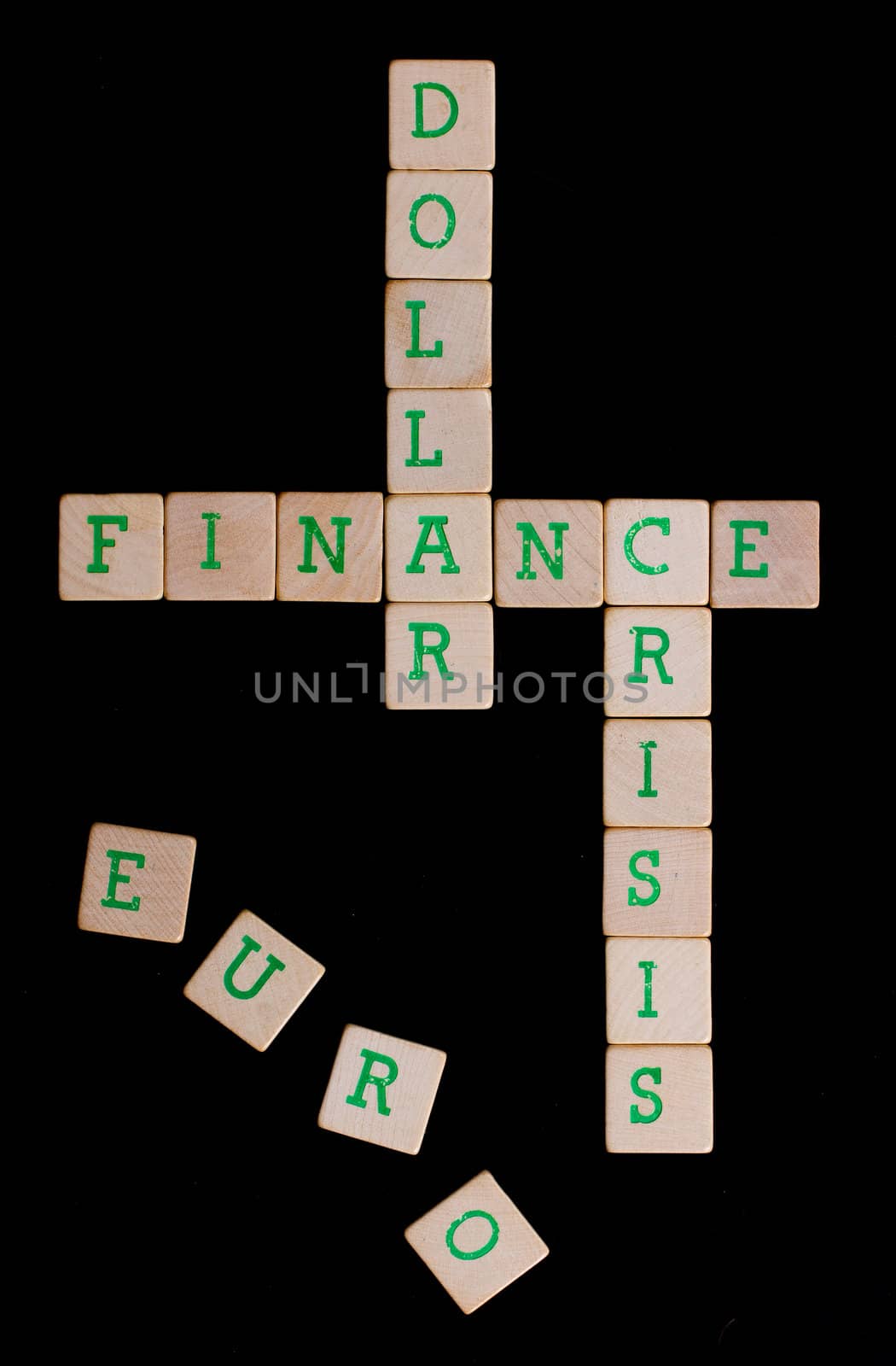 Green letters on old wooden blocks (euro, dollar, finance, crisis)