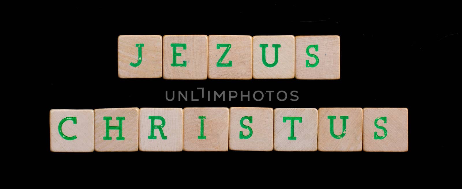 Green letters on old wooden blocks (Jezus Christus) by michaklootwijk