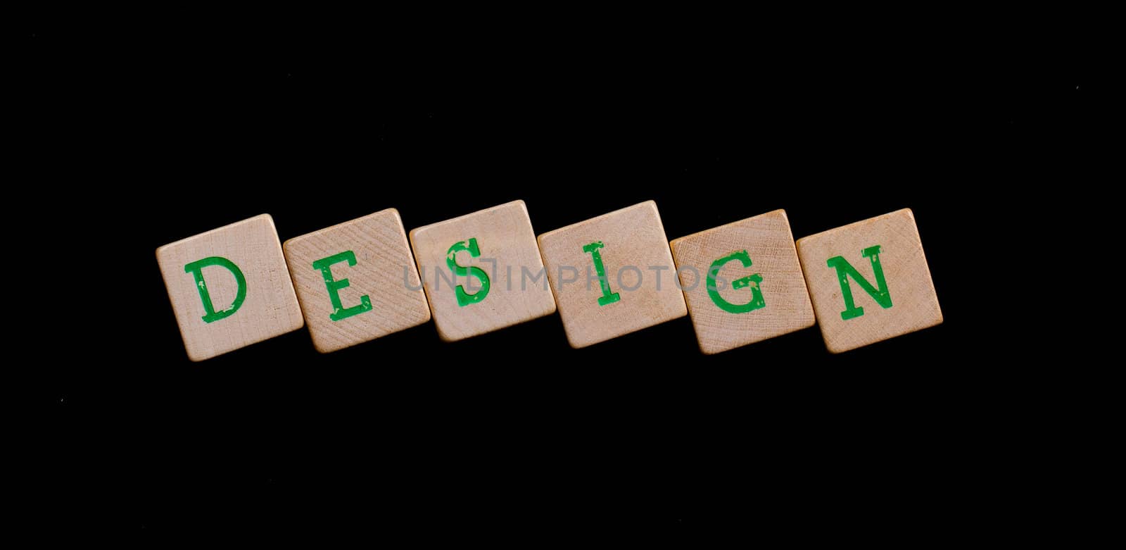 Green letters on old wooden blocks (design)