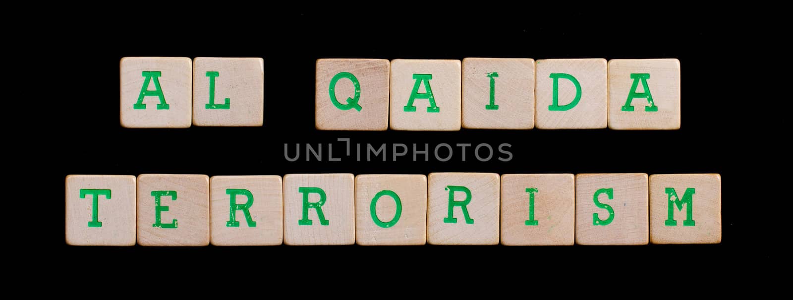 Letters on wooden blocks (alqaida terrorism) by michaklootwijk
