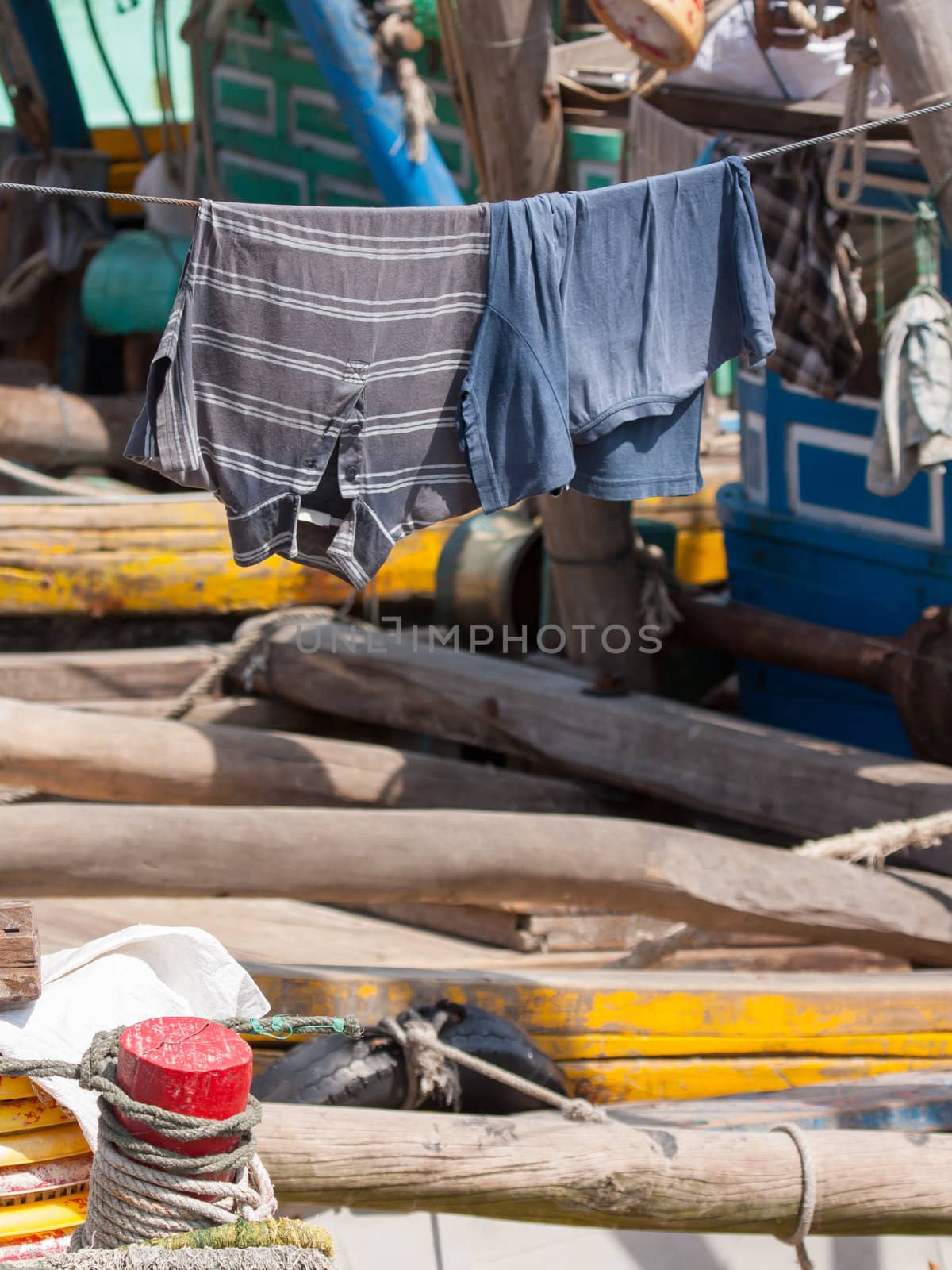Clothes drying on a washing line in a Vietnamese harbour