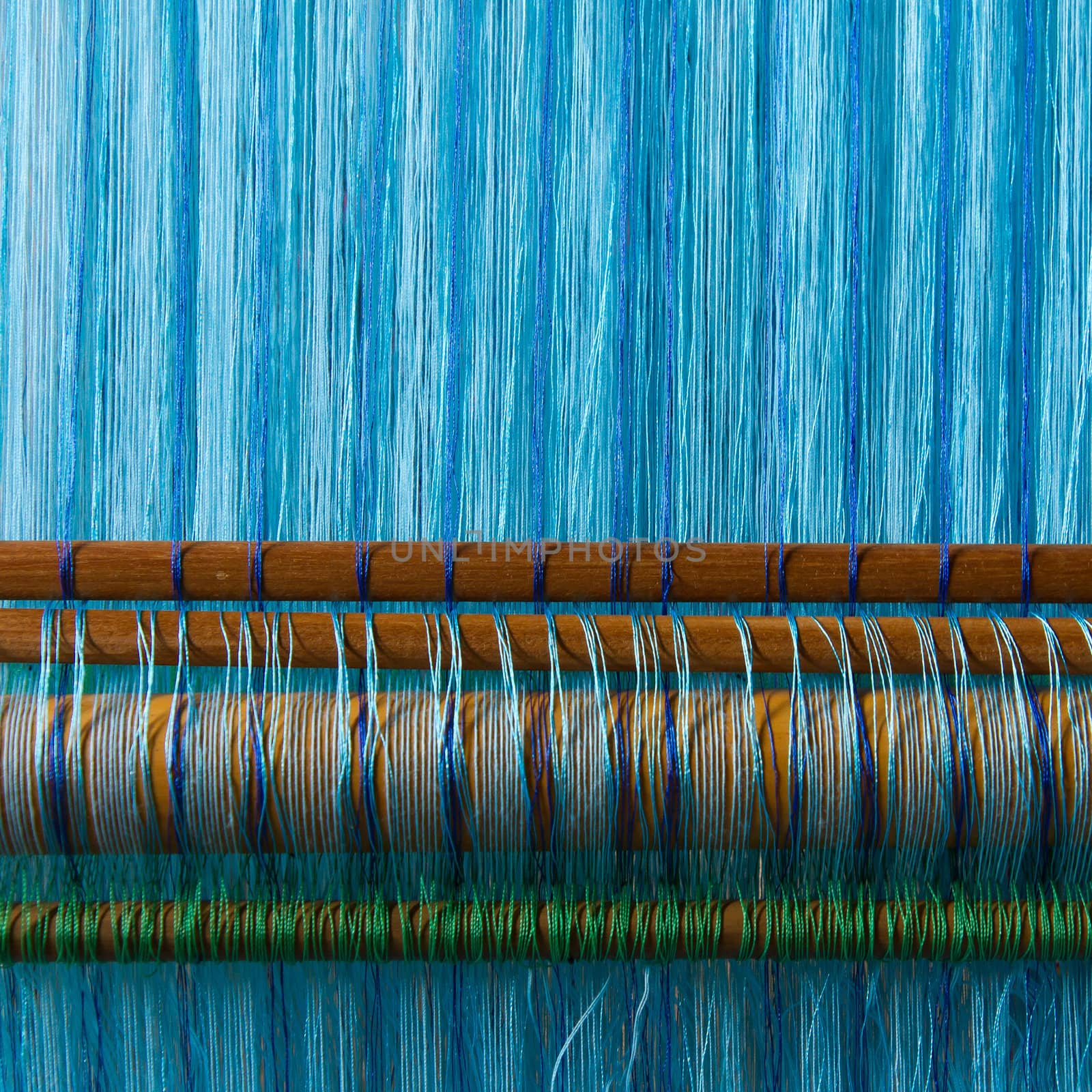 Handmade silk textile industry, silk scarf on a old machine (Vietnam)