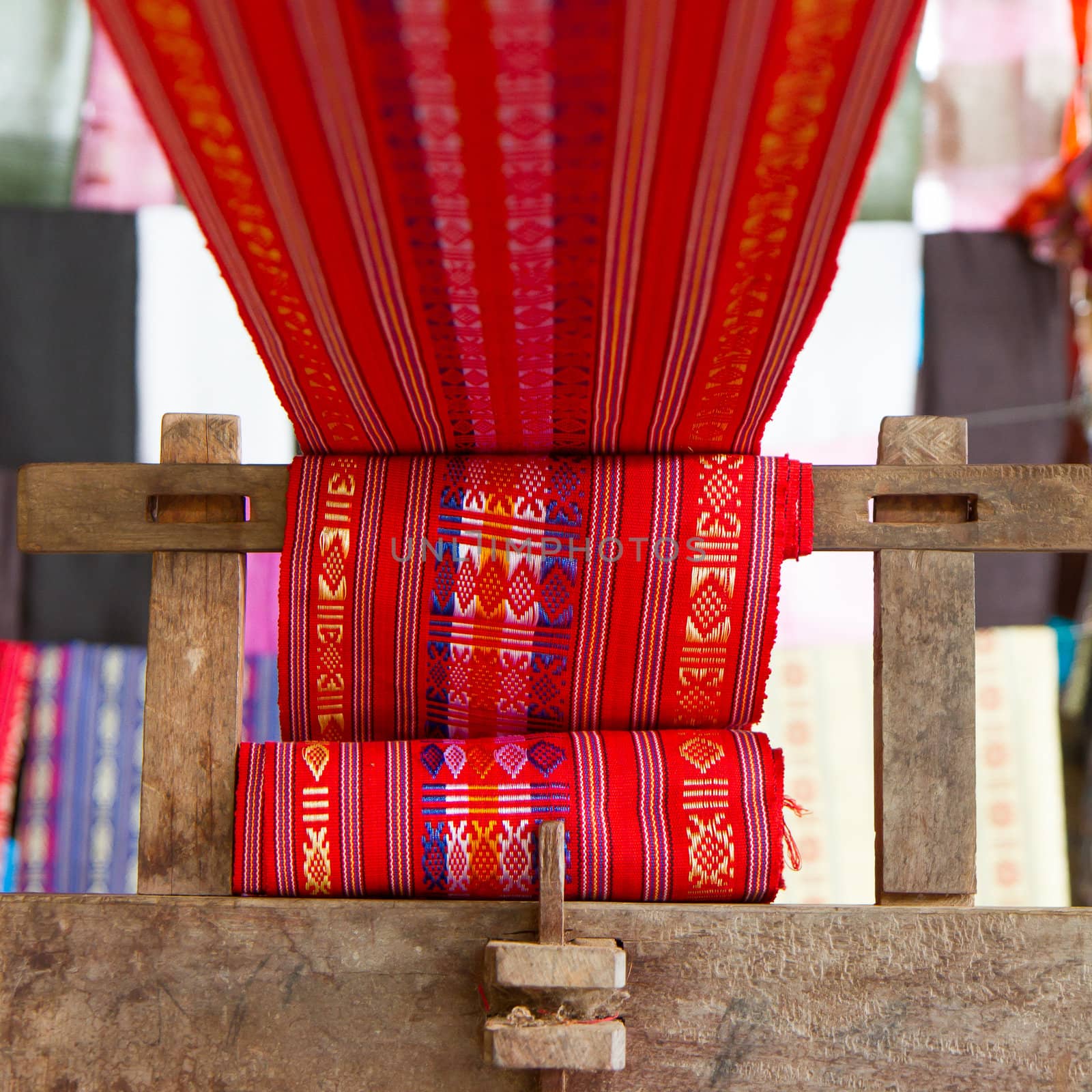 Handmade silk textile industry, silk scarf on a old machine by michaklootwijk