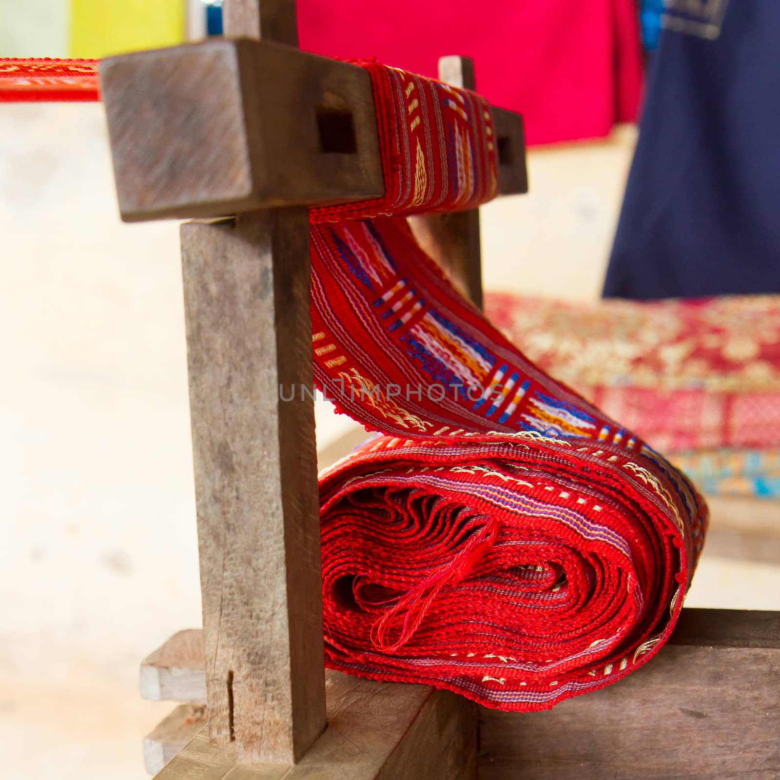 Handmade silk textile industry, silk scarf on a old machine (Vietnam)