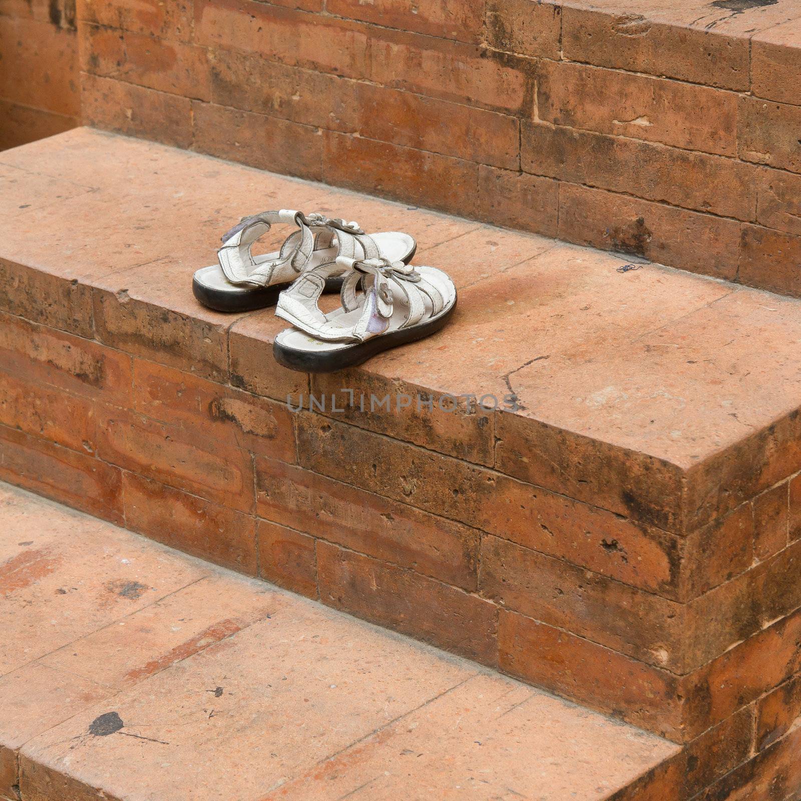 Shoes at the old entrance of a mosque