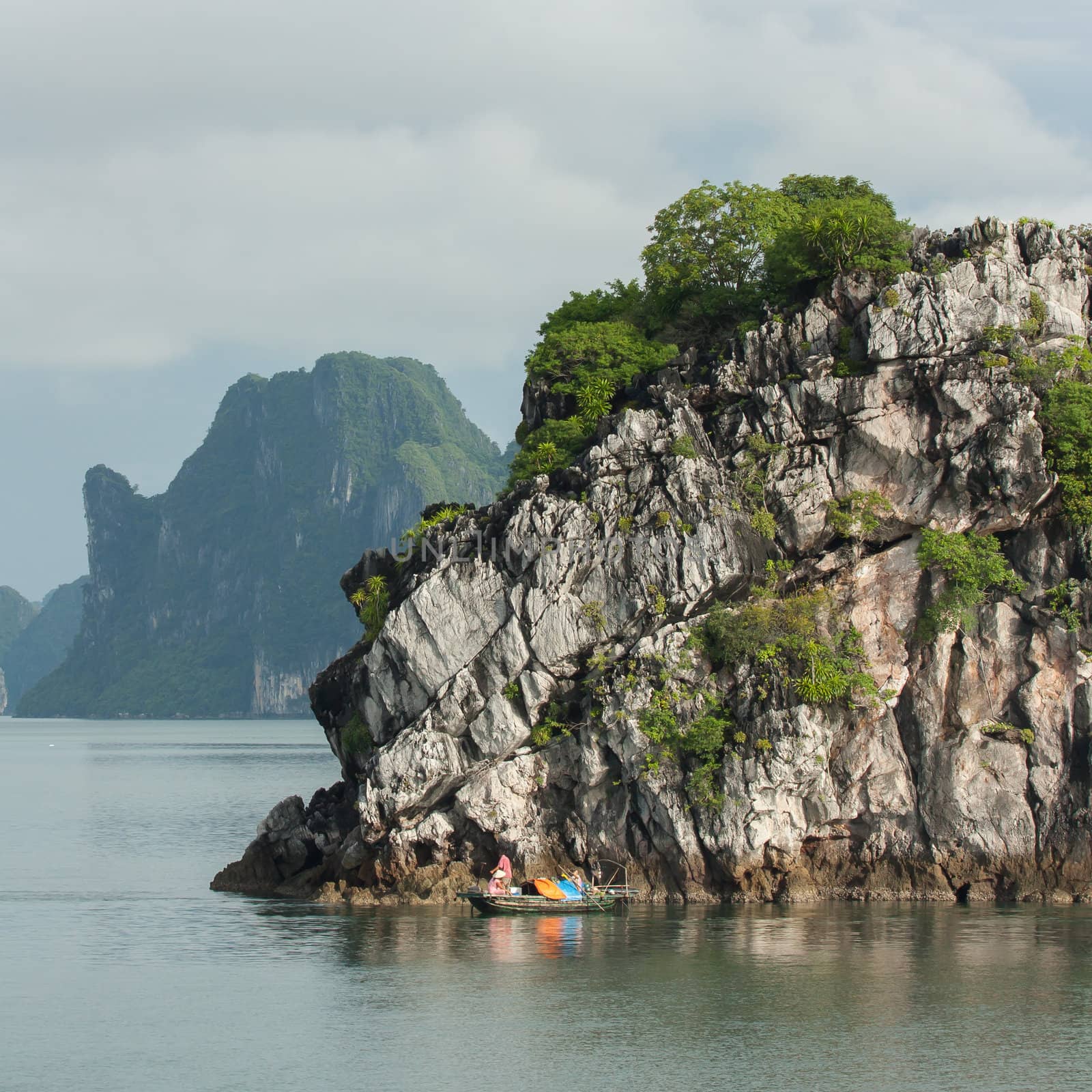 Fishing boat in the Ha Long Bay by michaklootwijk