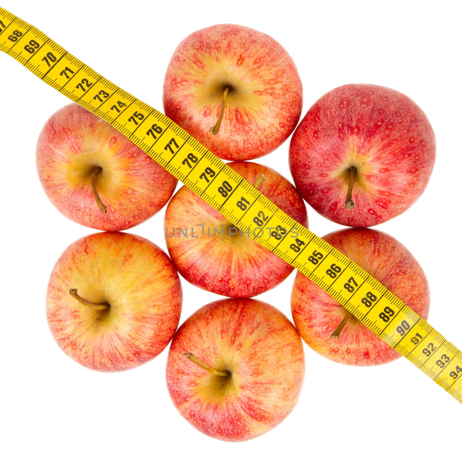 Apple diet, red apples with a yellow tape-measure