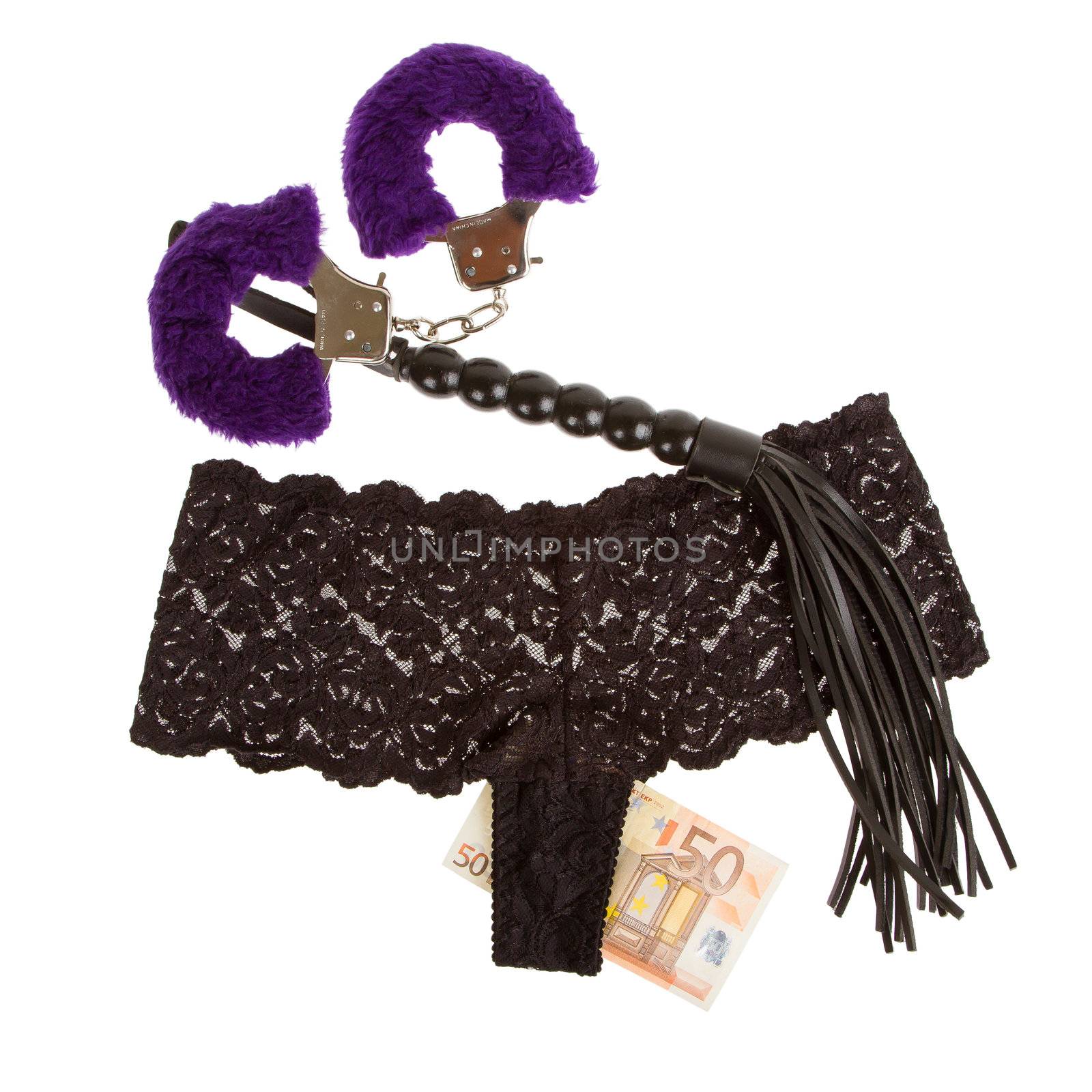 Fluffy purple handcuffs, a whip, money and panties on a white background, prostitution