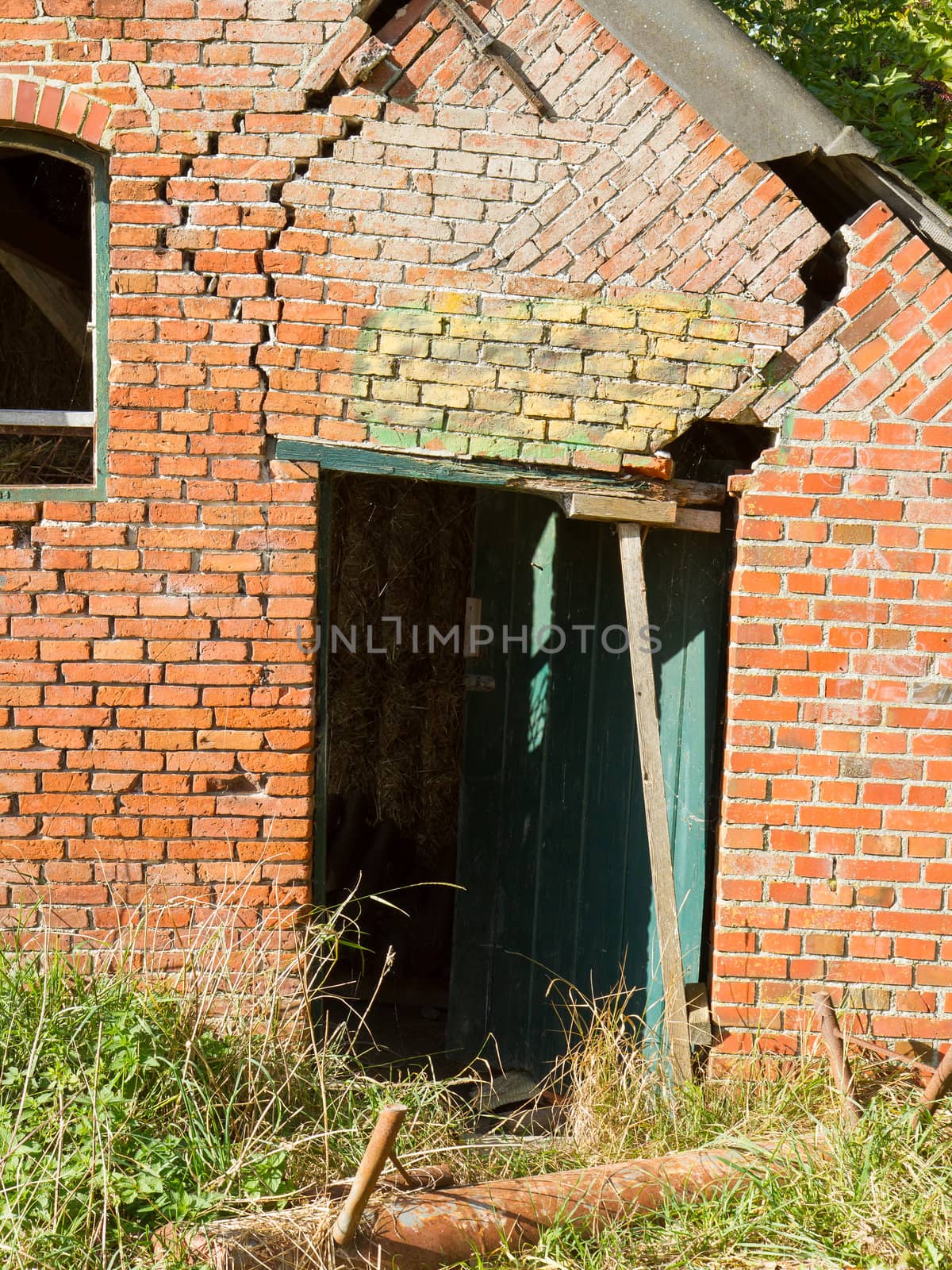 Broken doorway in an old brick wall