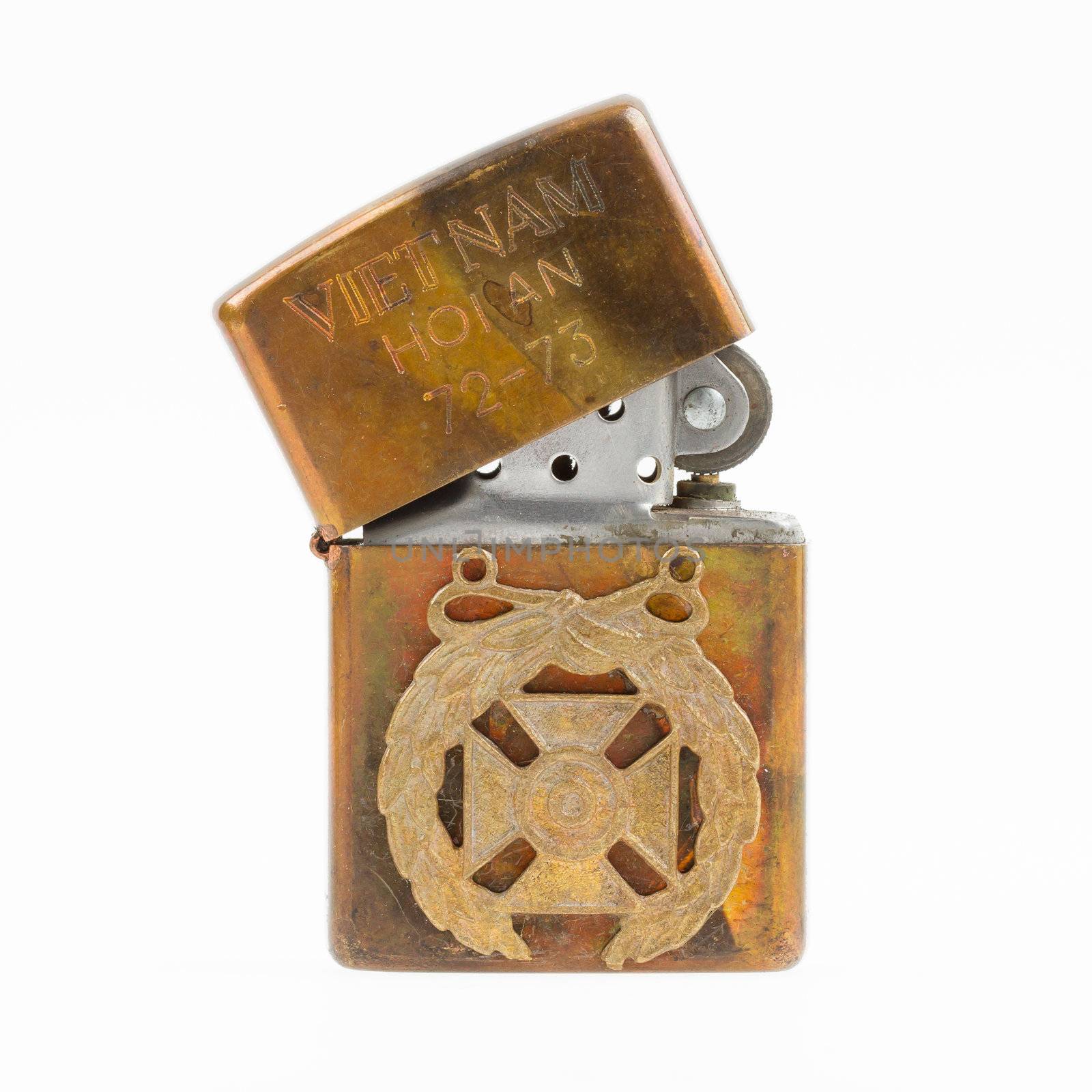 Very old lighter from the Vietnam war on a white background