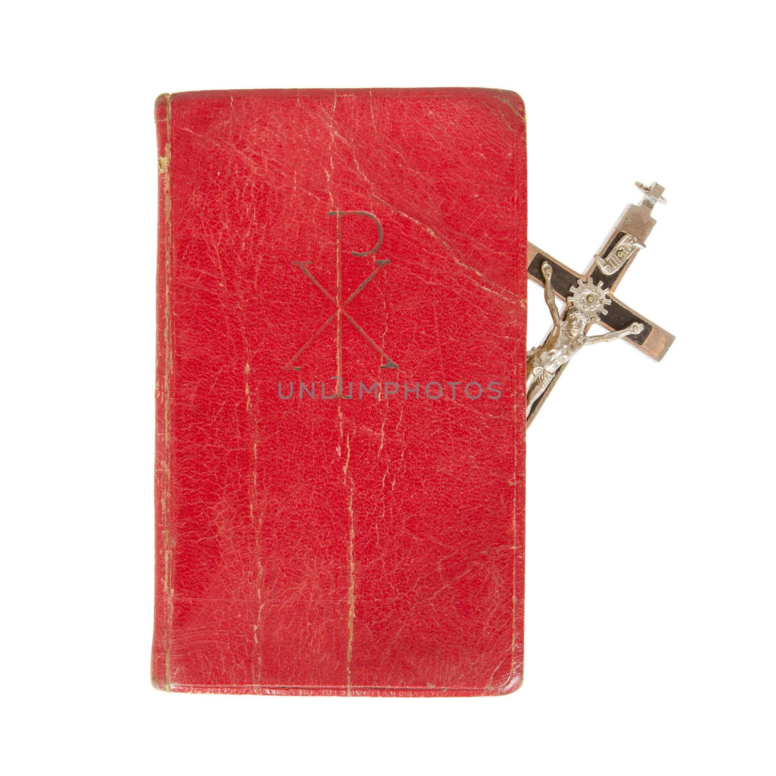 Old antique bible and cross on a white background, isolated