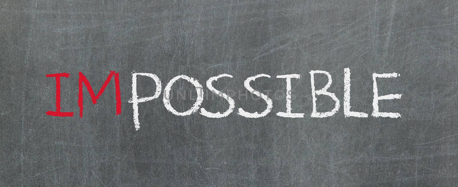 Possible and impossible written on a blackboard