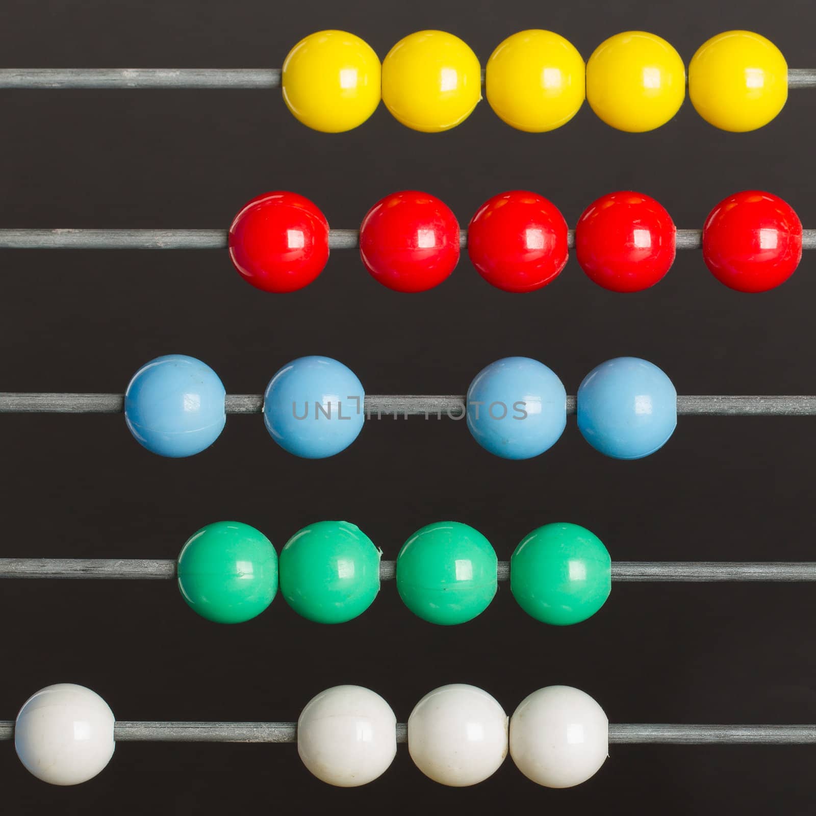 Close-up of an abacus on a grey background