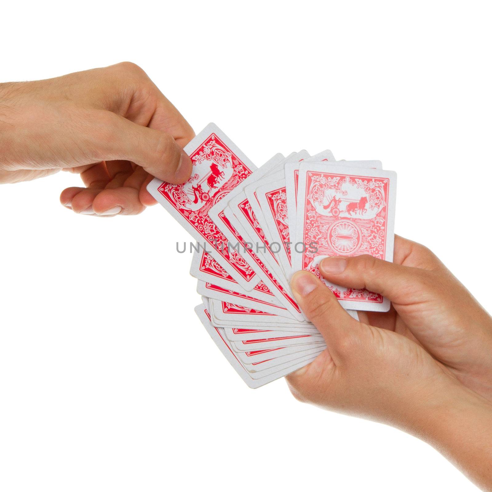 Man picking a playing card from a deck of cards