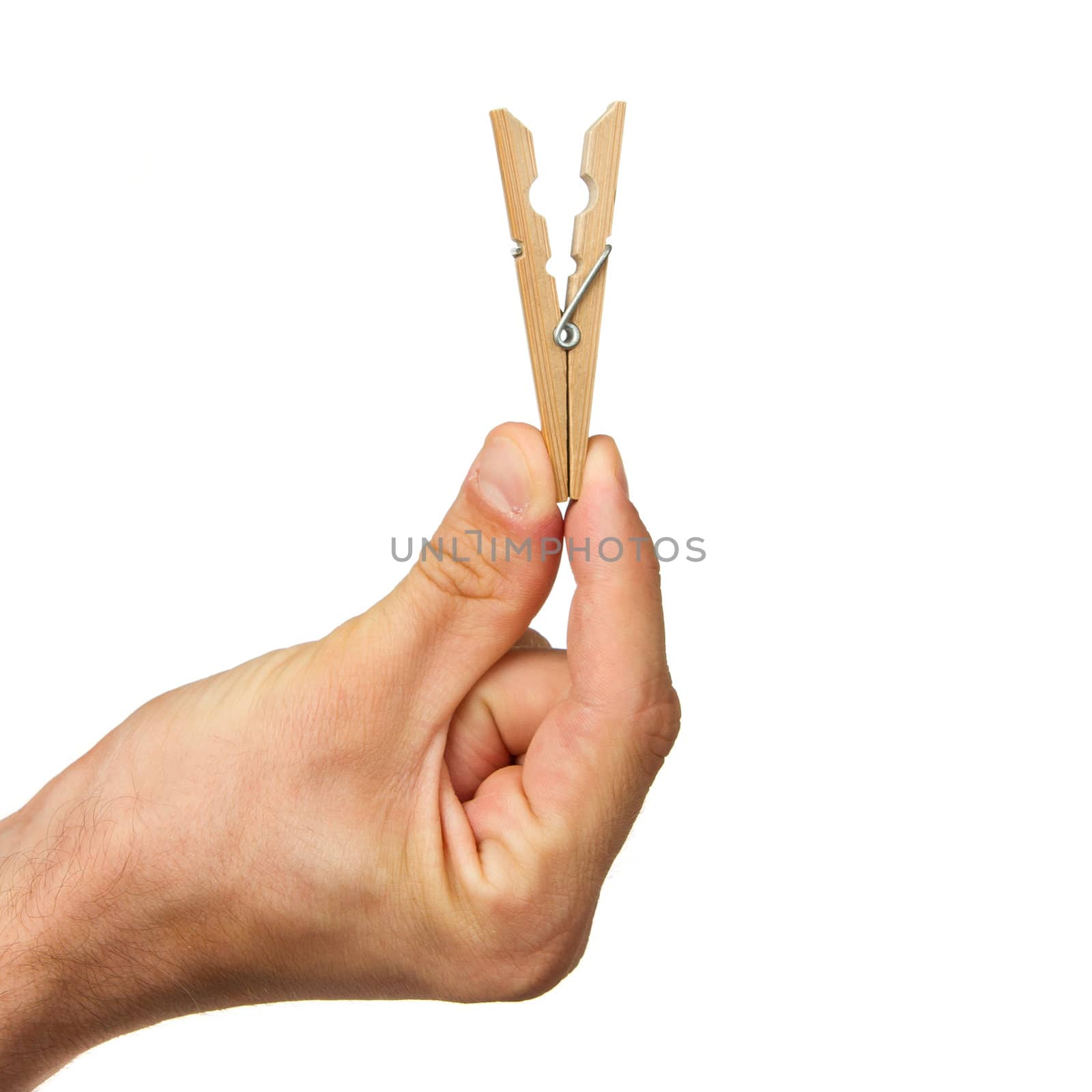 Hand holding clothes peg on white background