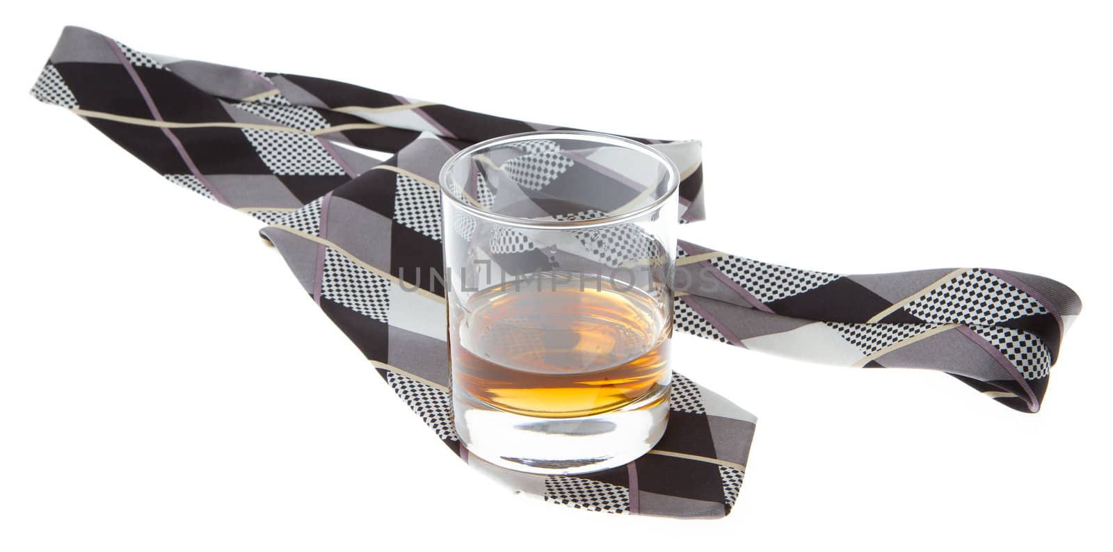 Glass of whisky and a tie isolated on a white
