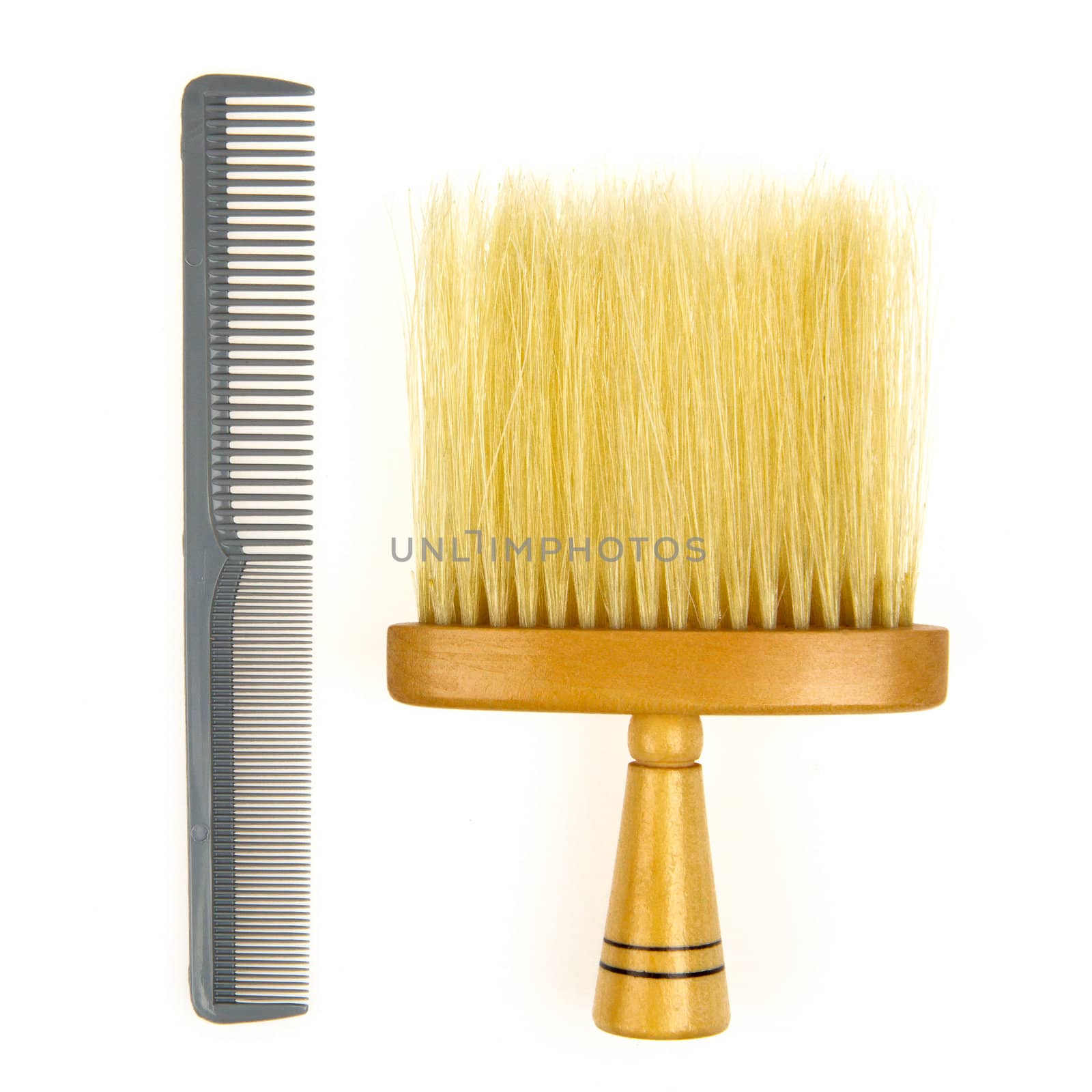 Hair brush for barber and a grey comb isolated on a white background