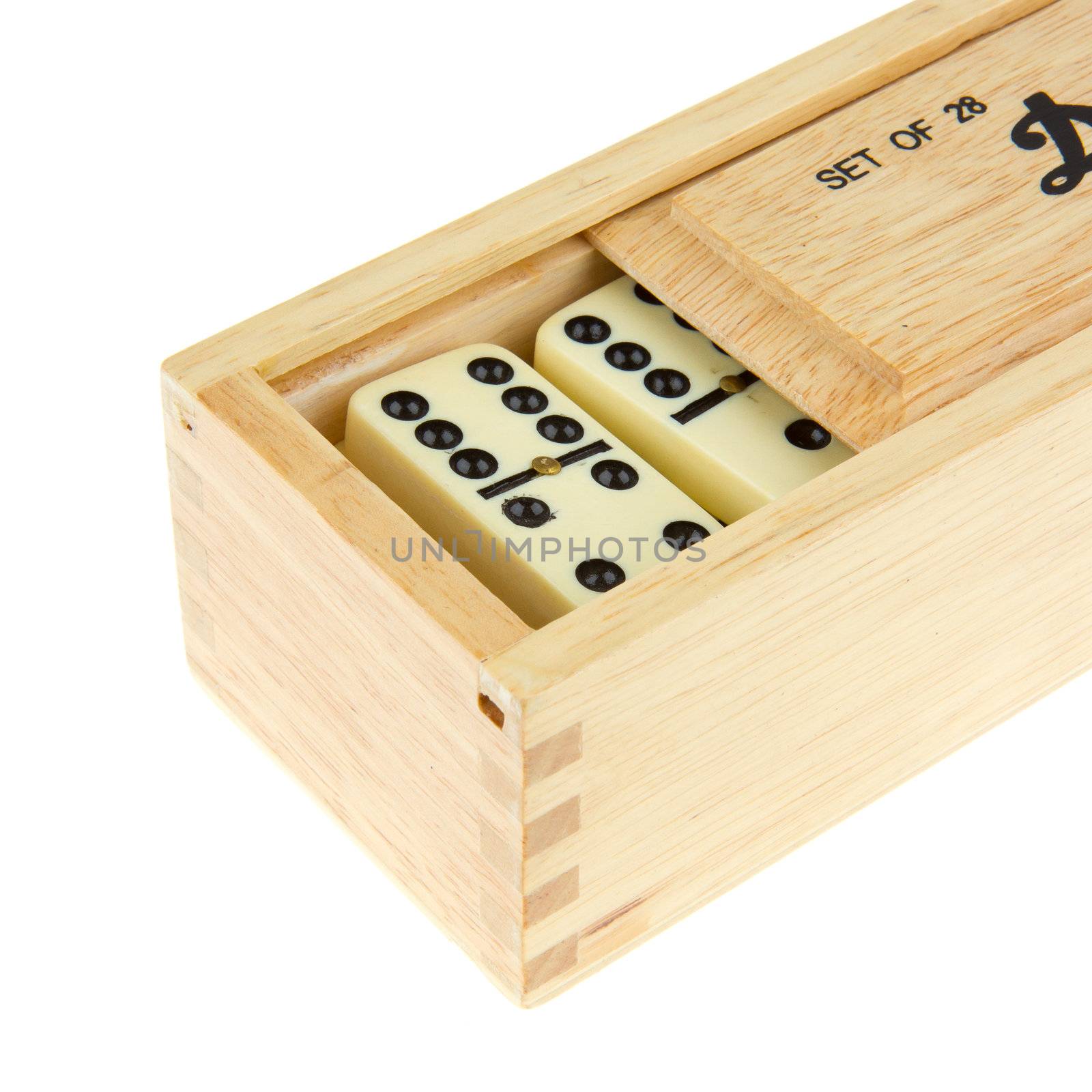 Domino in wooden box against the white background