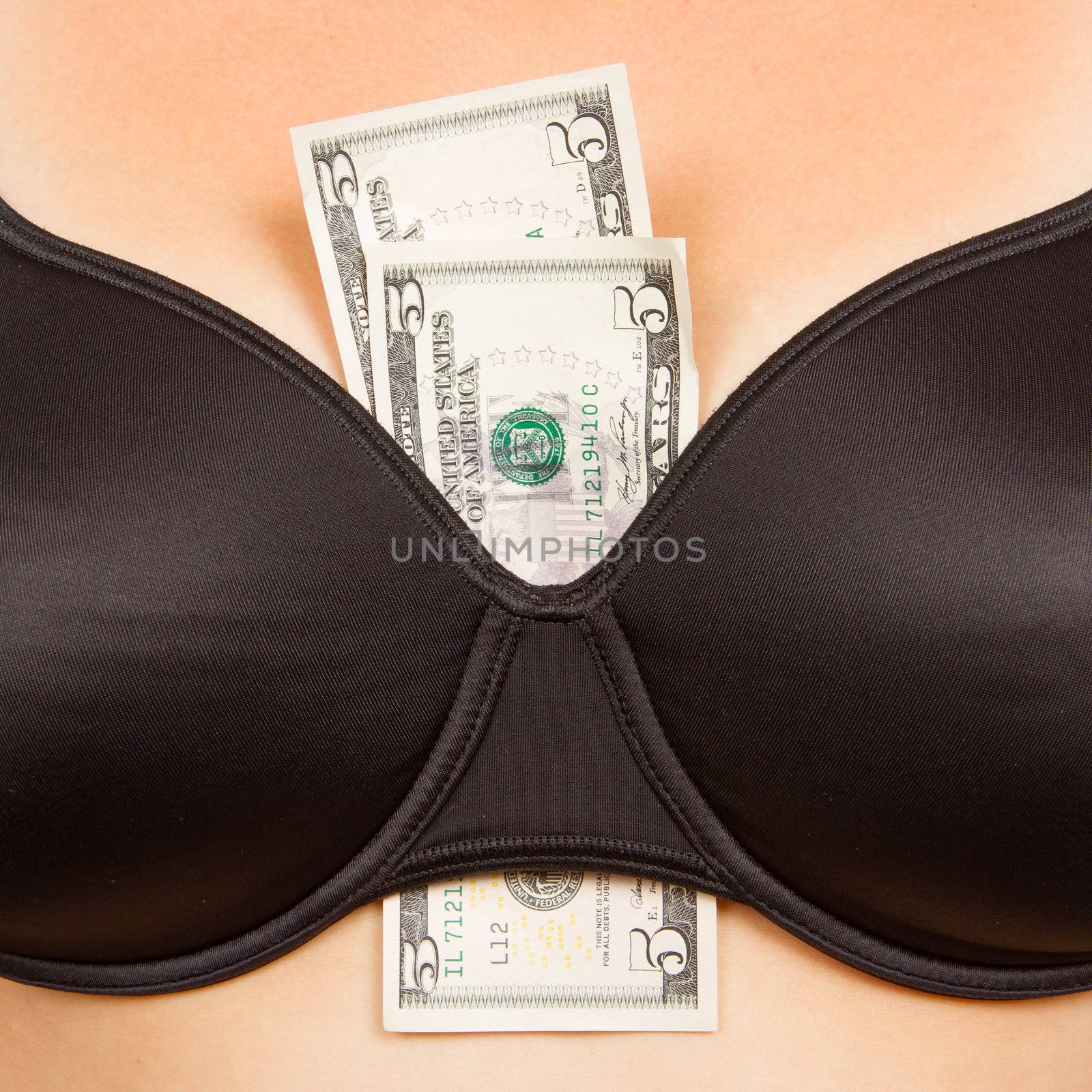Concept - woman with cash in a bra by michaklootwijk