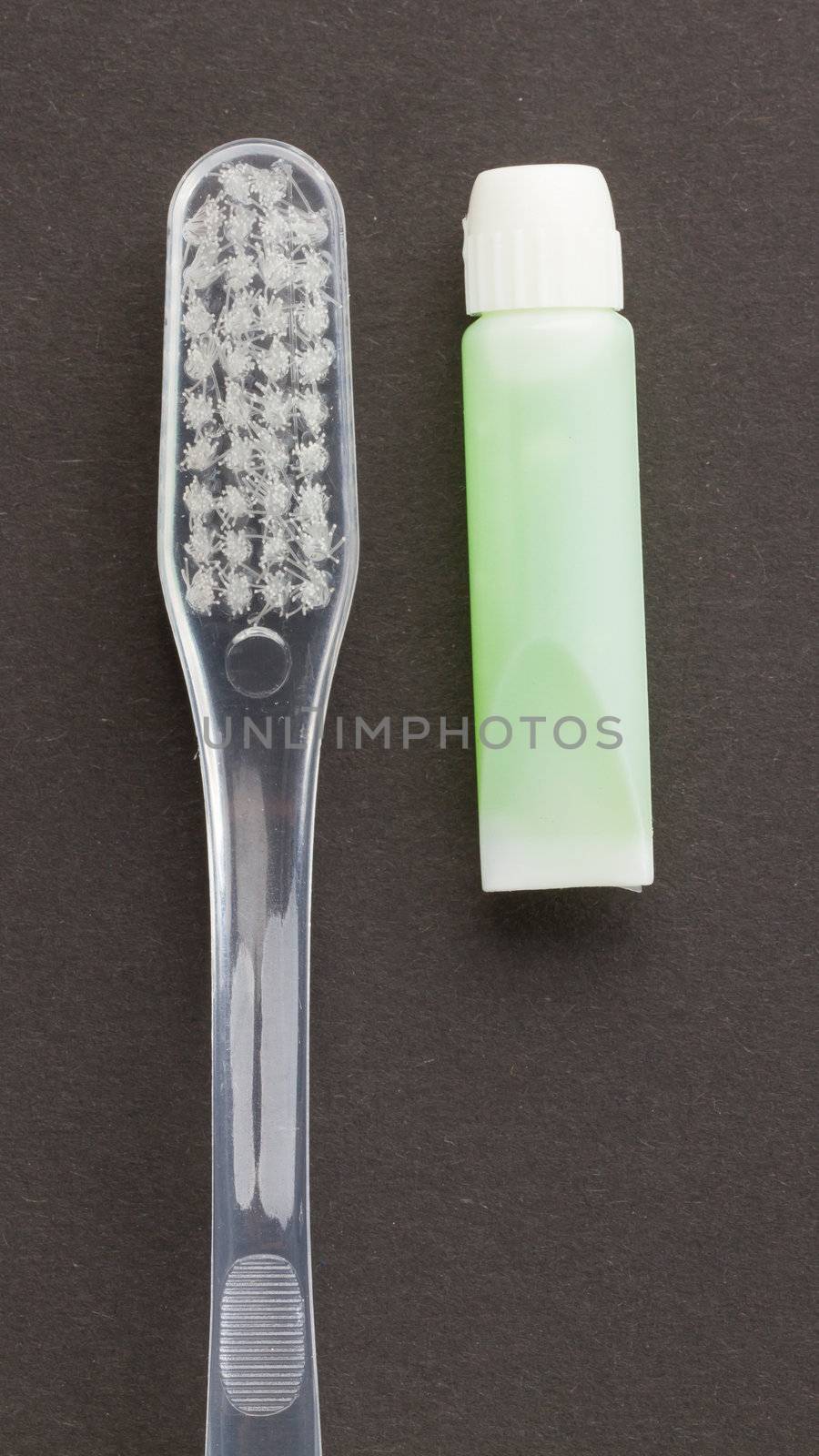 Toothbrush and green toothpaste isolated by michaklootwijk