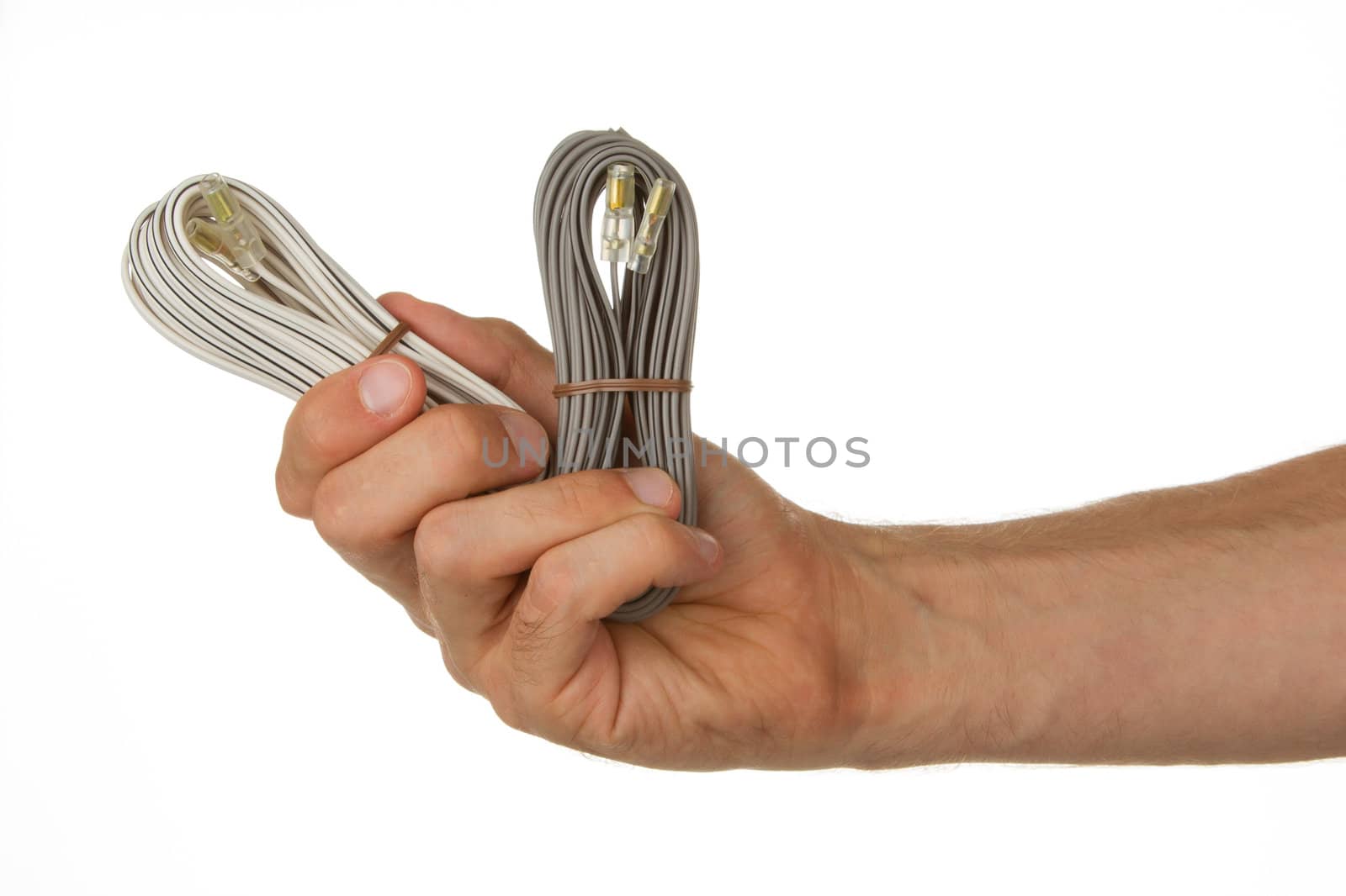 Speaker cable in a hand, isolated on a white background