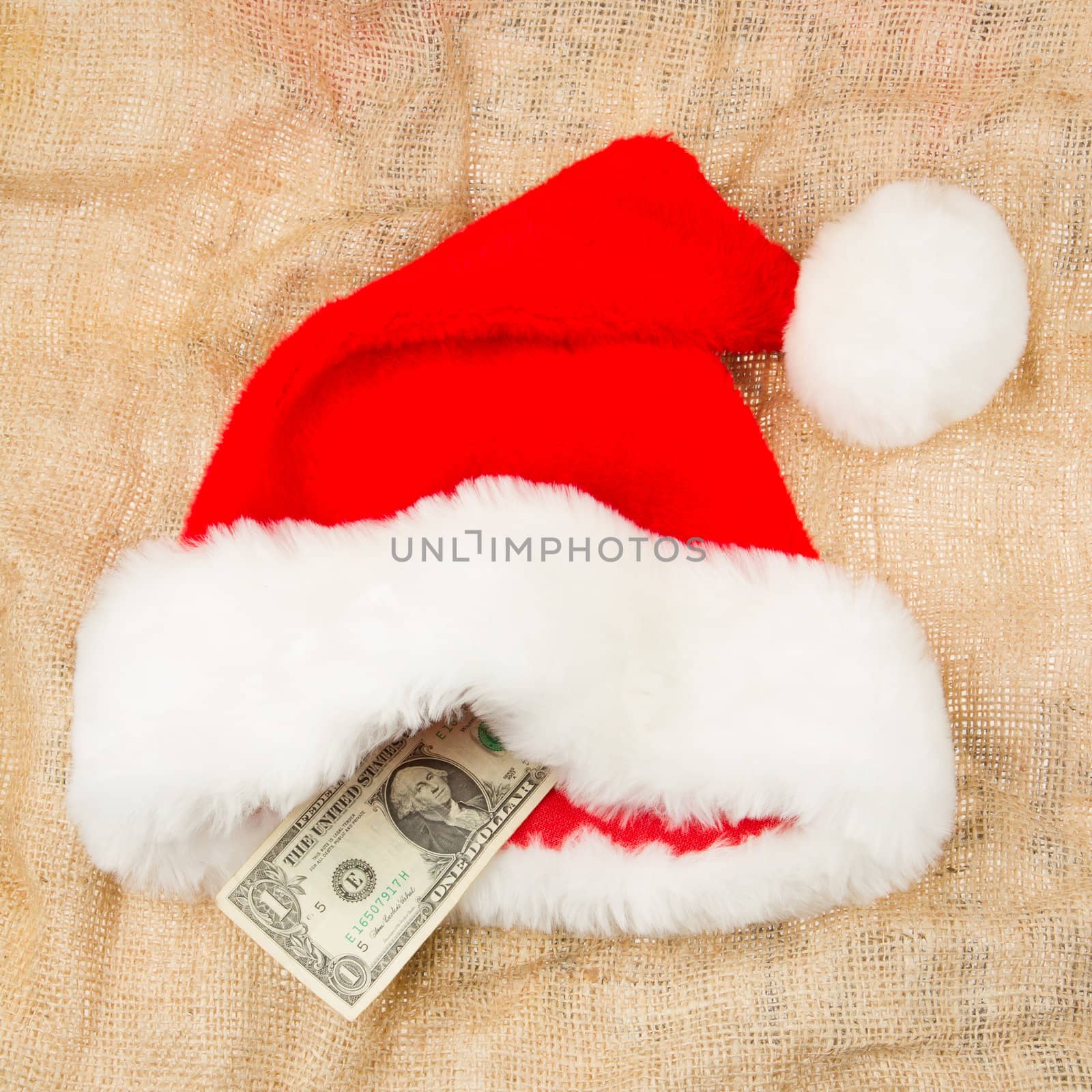 Santa's crisis budget, one dollar in his hat