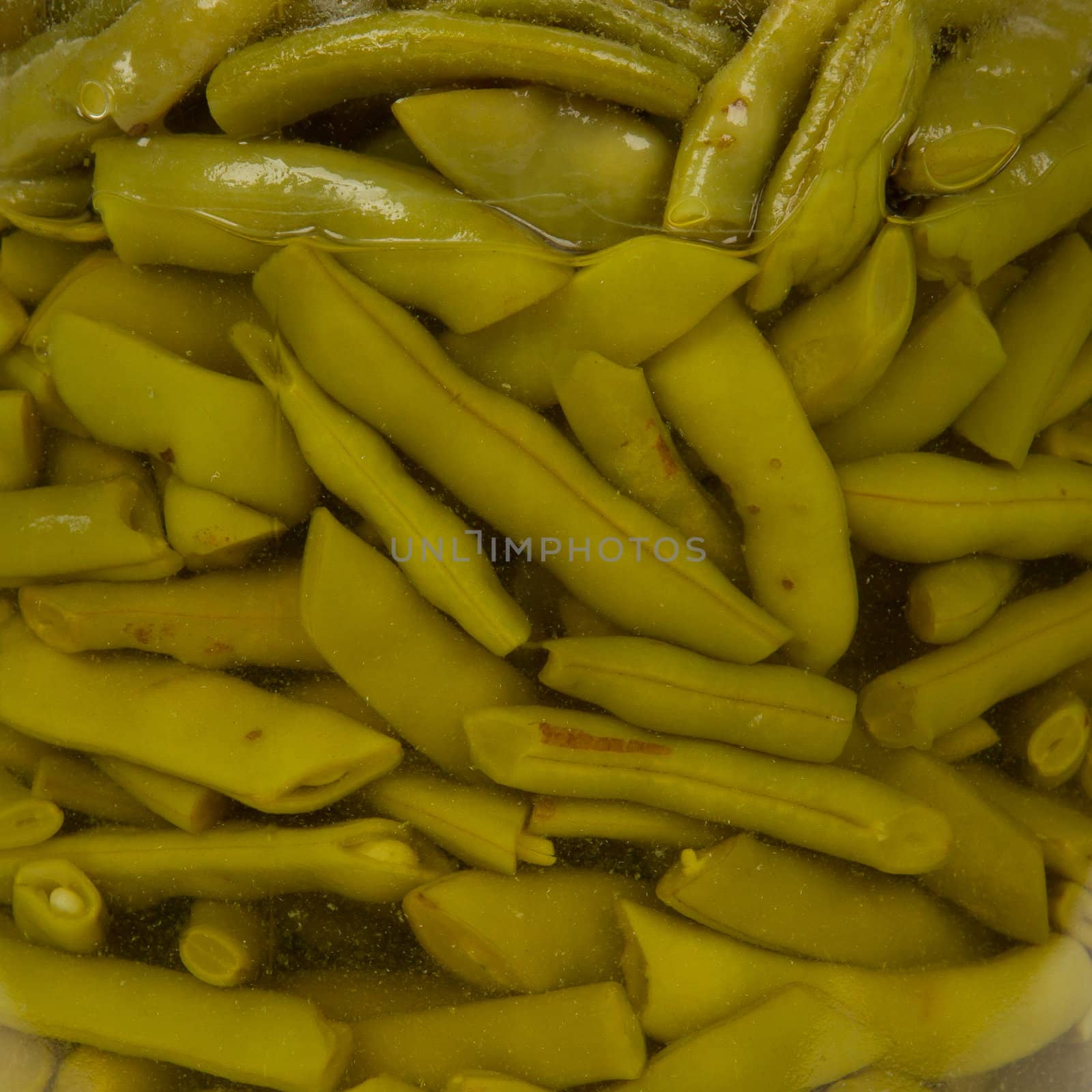 Preserving jar containing french beans, isolated on white