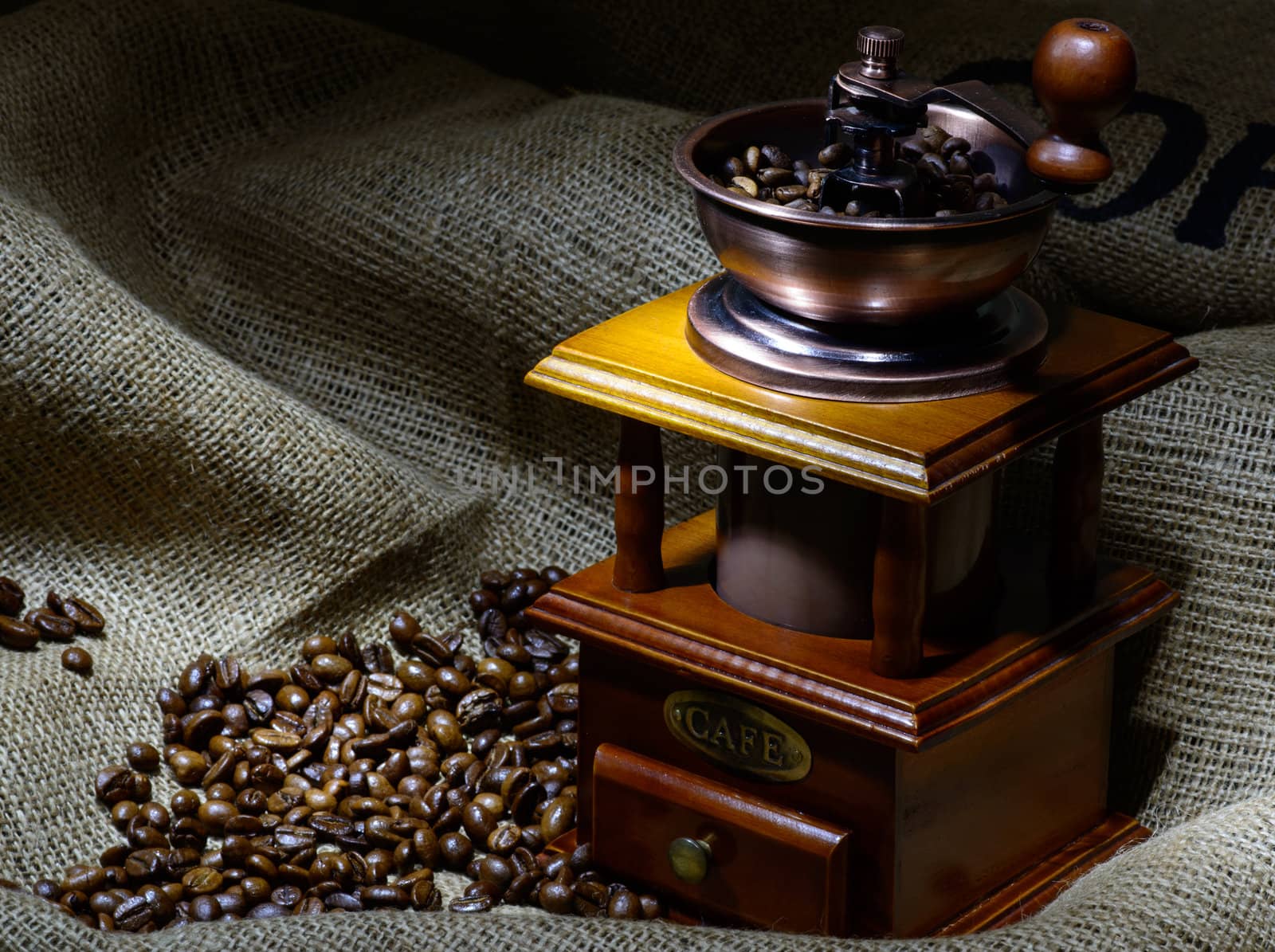 Coffee Mill with beans and burlap. still life