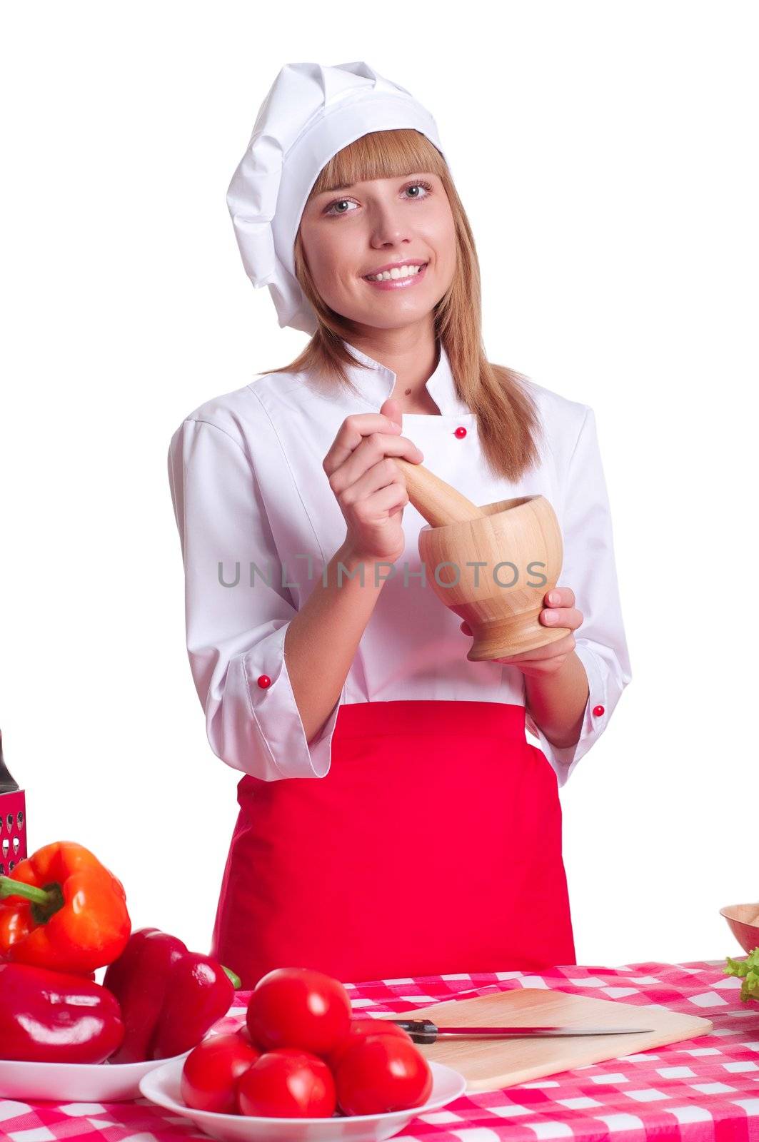 attractive cook chef costume preparing the spices in a mortar