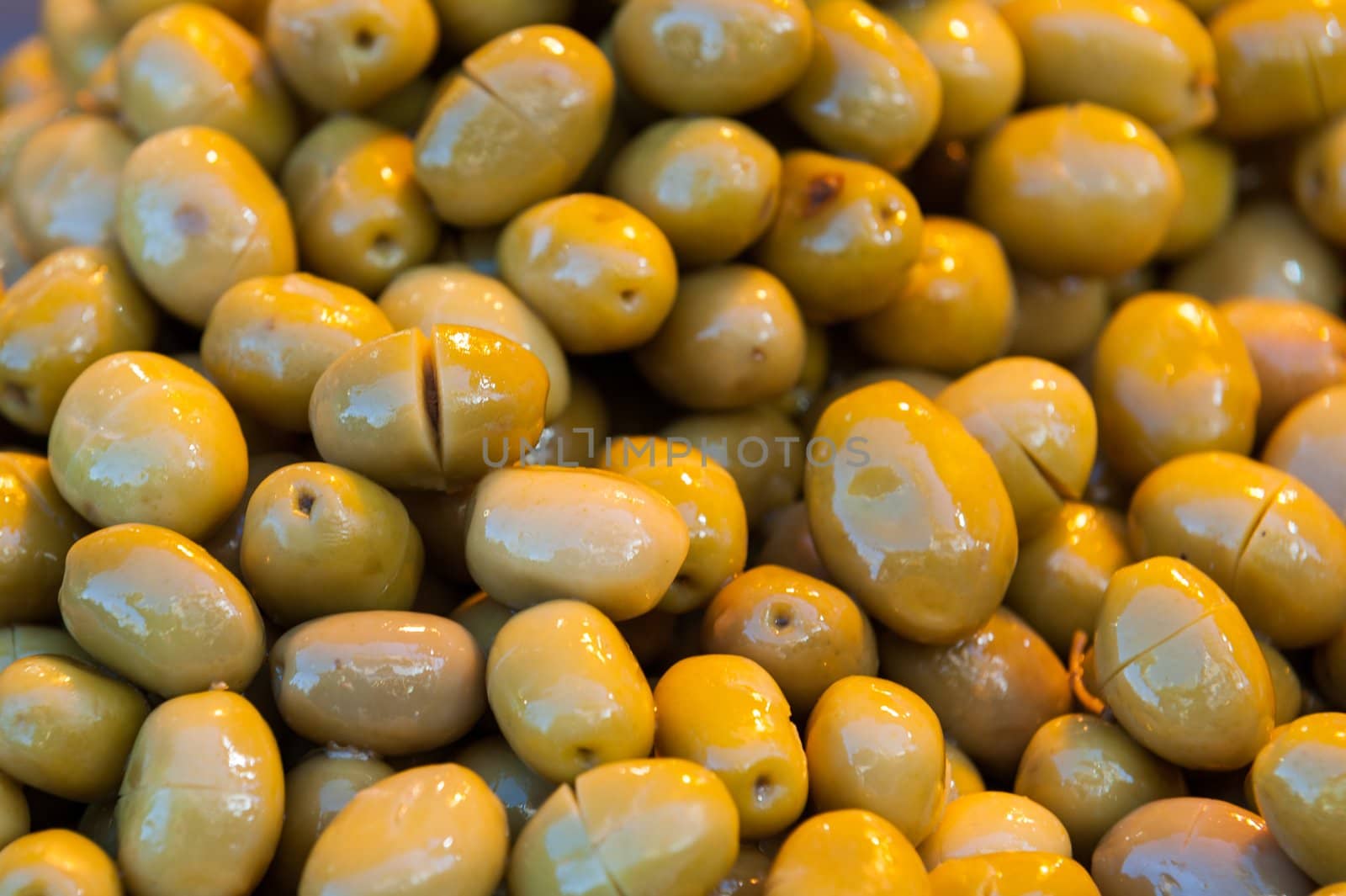 Fresh shiny green olives closeup macro