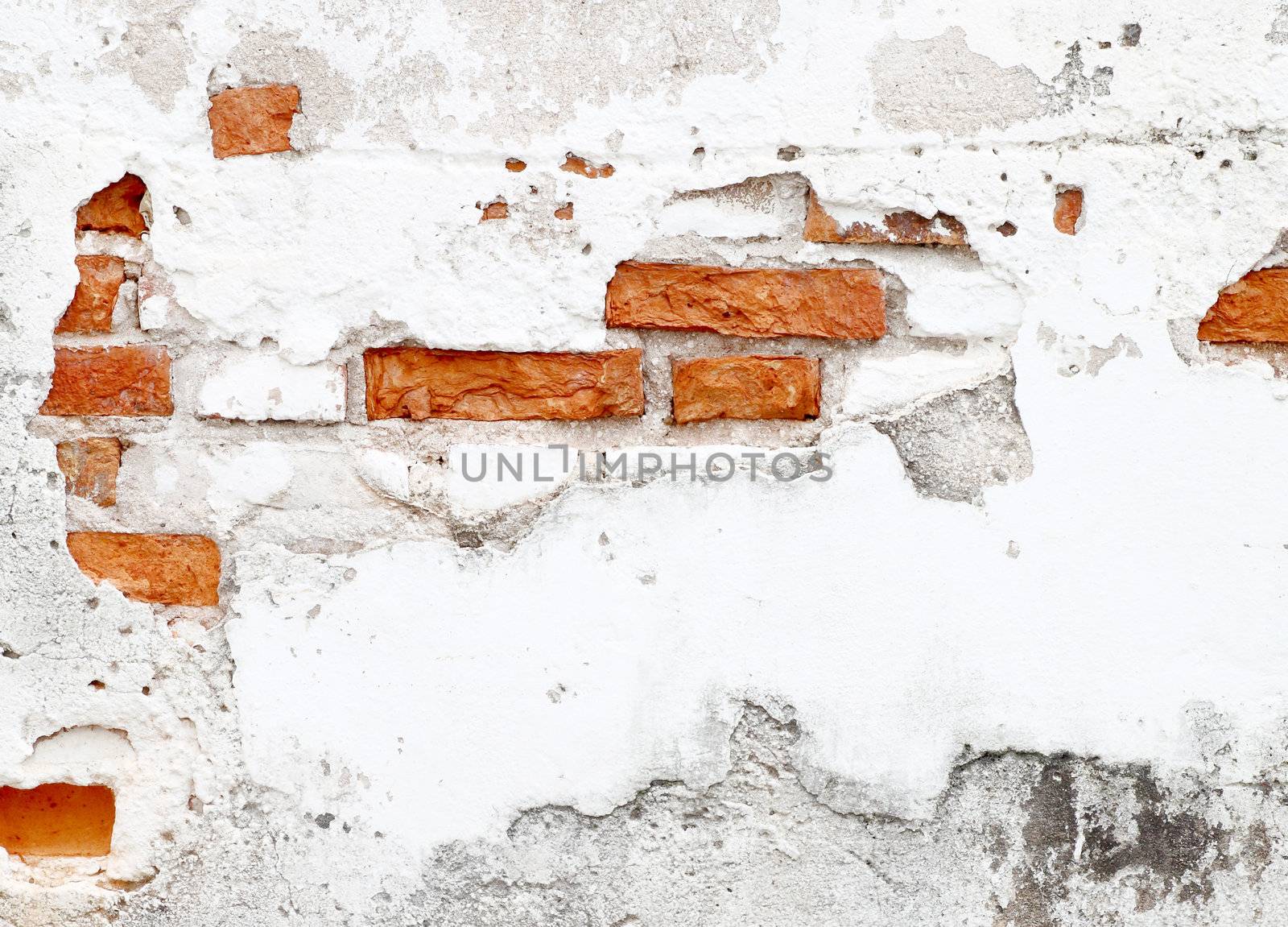 An old worn down red brick wall by geargodz