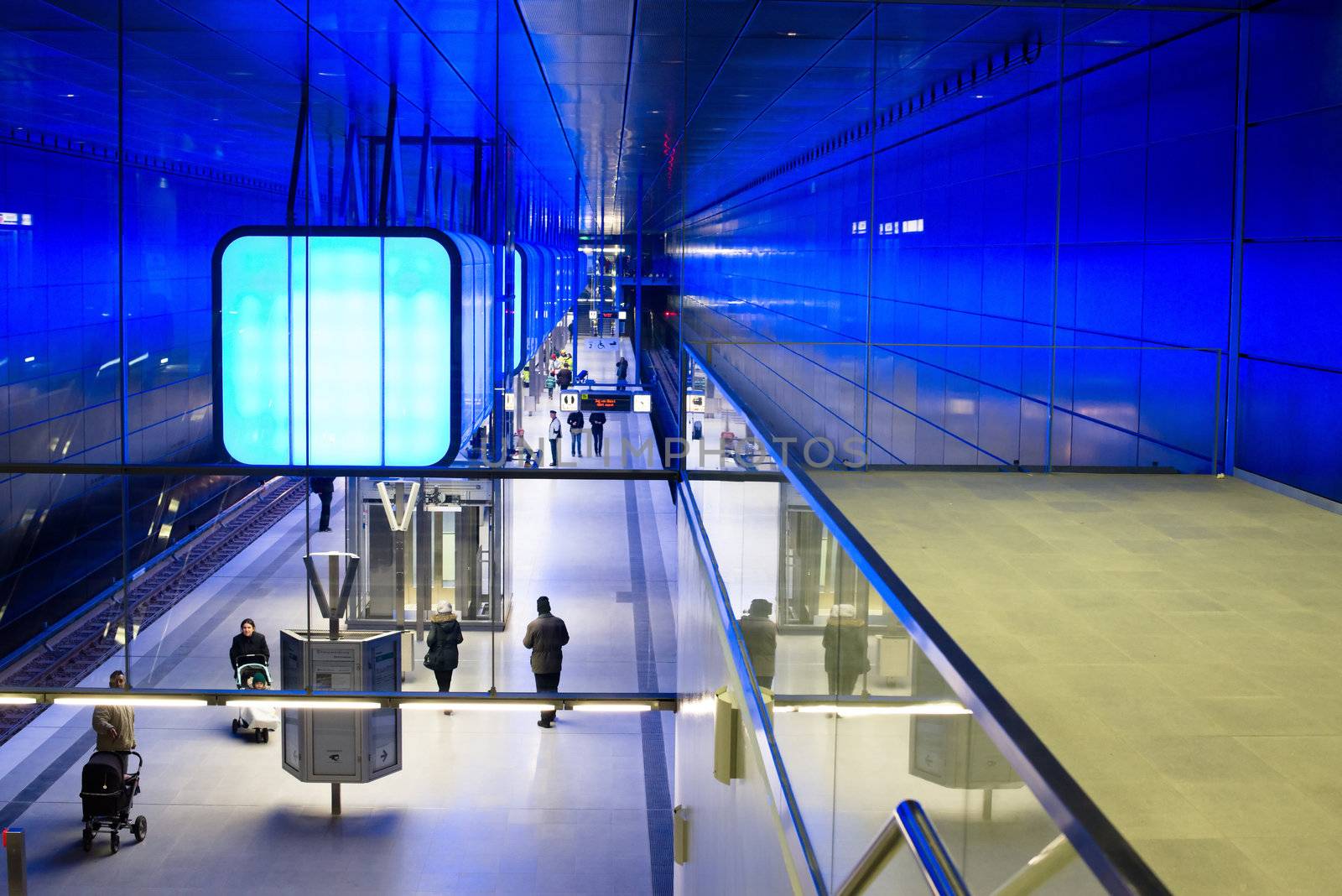 HAMBURG - DECEMBER 2, 2012: First passengers are using the new underground station “Hafencity University” in Hamburg Hafencity on December 2, 2012 in Hamburg Germany. The station connects the exciting newly built area of Hafencity with the rest of Hamburg – currently the public can test drive the line for free before the station is officially connected with the timetable of the underground.