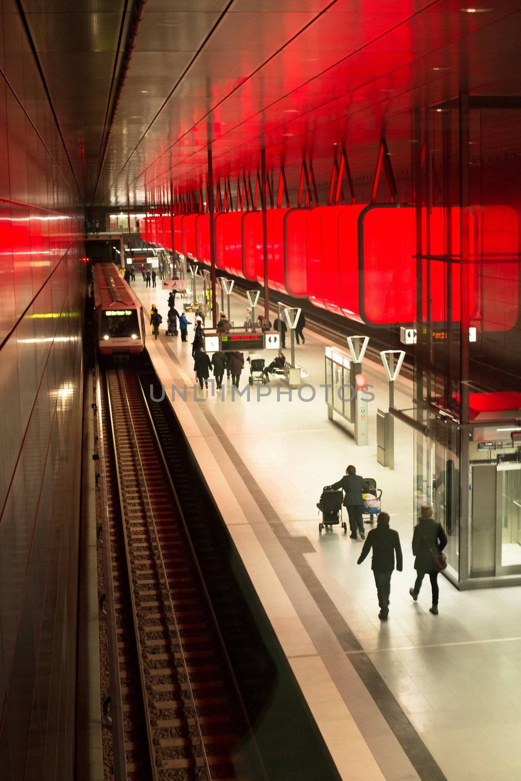 HAMBURG - DECEMBER 2, 2012: First passengers are using the new underground station “Hafencity University” in Hamburg Hafencity on December 2, 2012 in Hamburg Germany. The station connects the exciting newly built area of Hafencity with the rest of Hamburg – currently the public can test drive the line for free before the station is officially connected with the timetable of the underground.