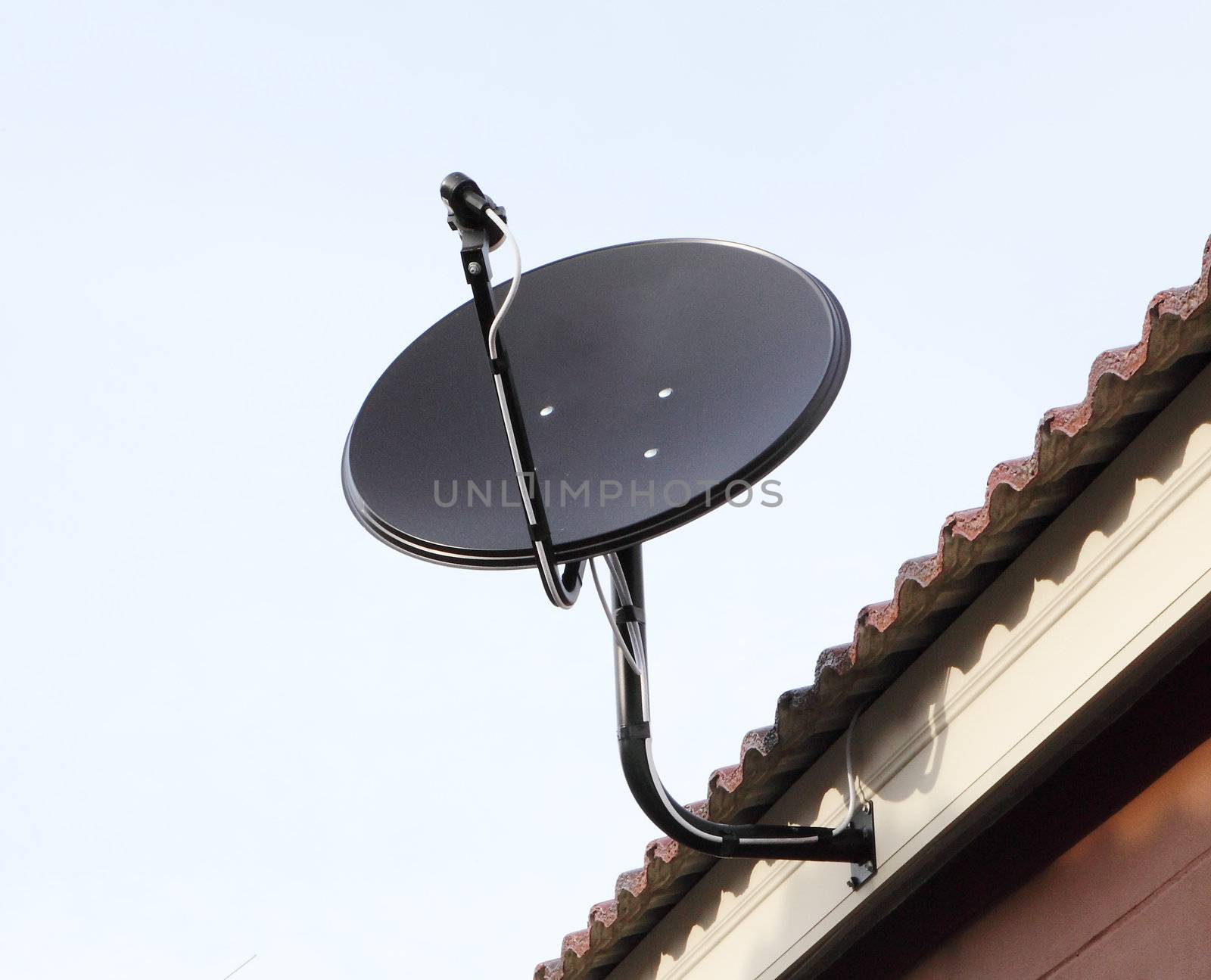 Black satellite antenna dish on the roof by geargodz