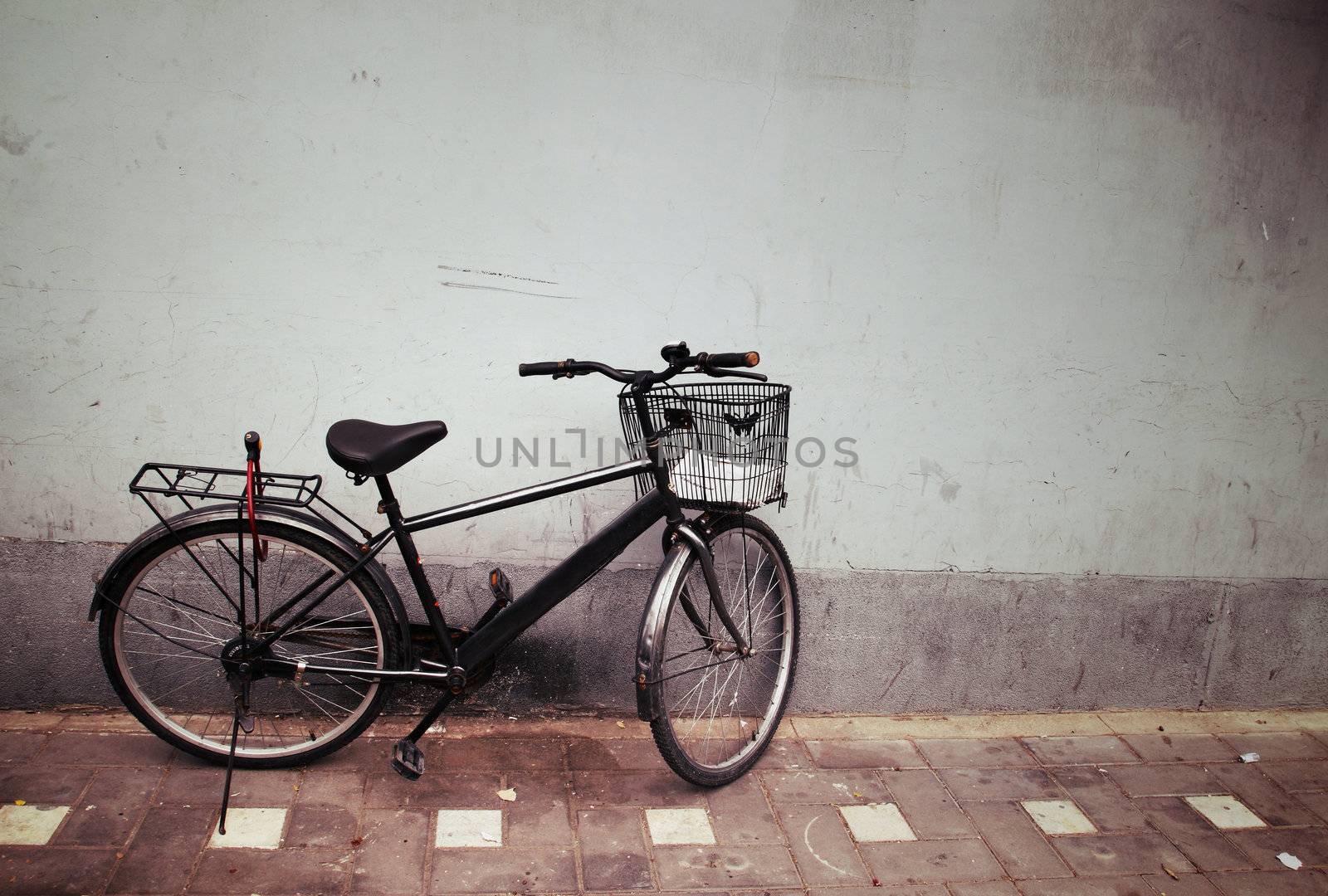 Old Bicycle against a Wall by geargodz