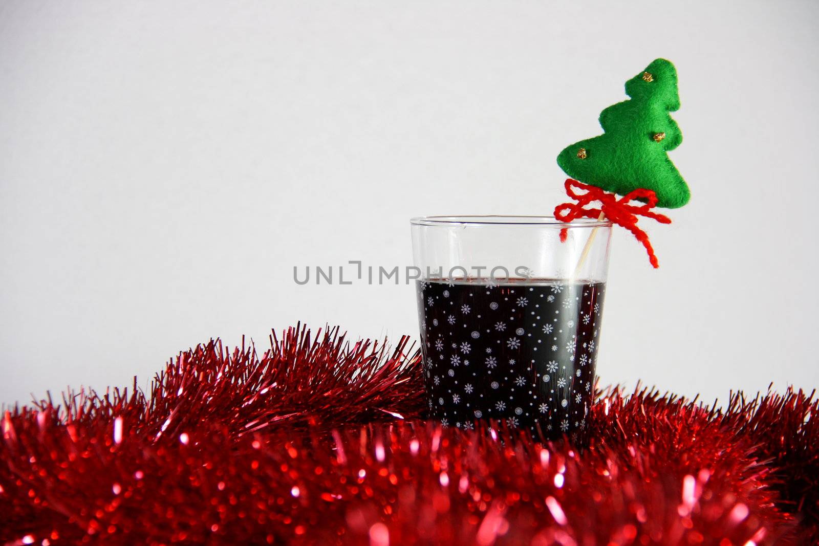 cocktail in christmas on white background with red bokeh