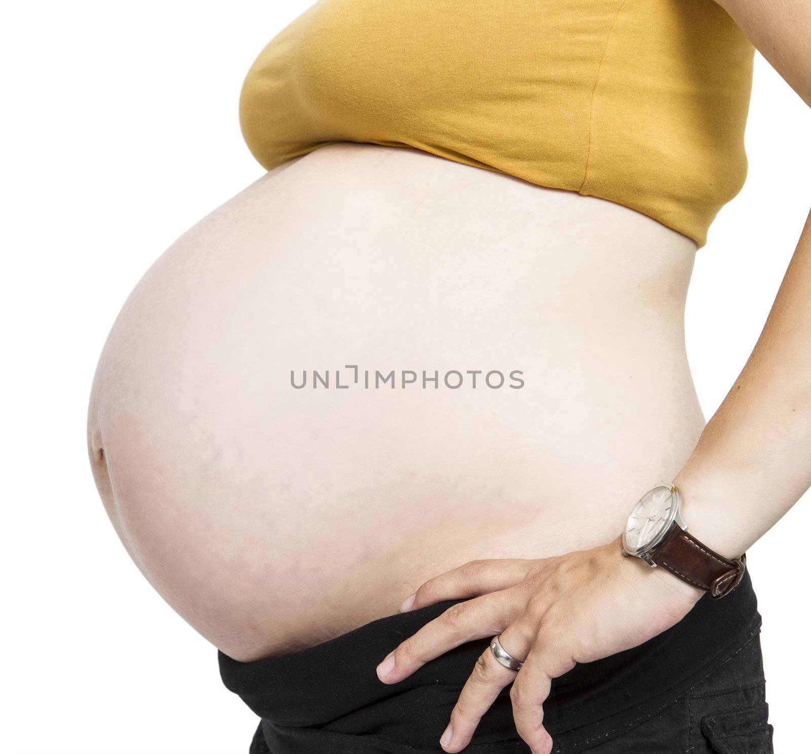 Pregnant belly isolated on white background.