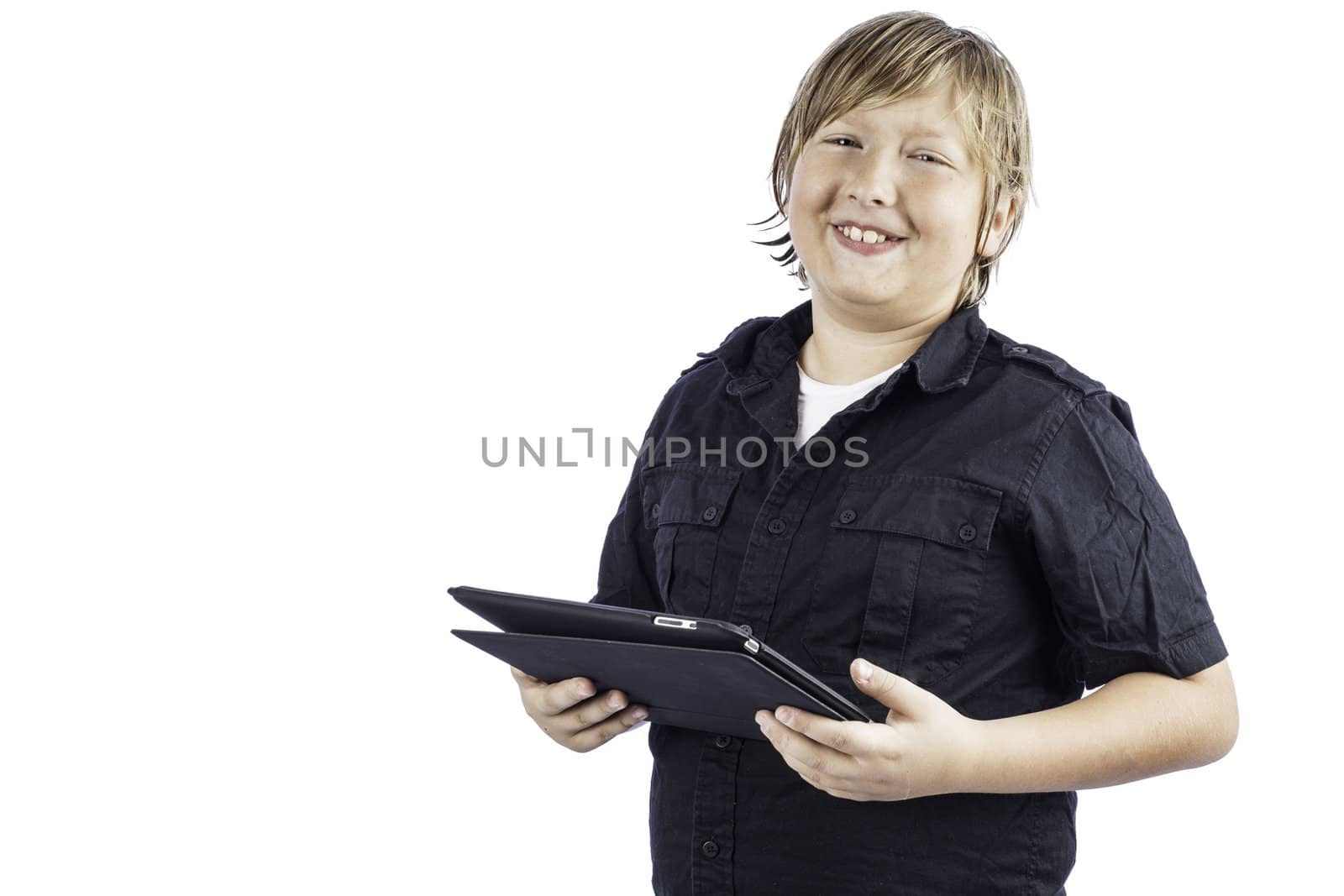 A young boy isolated on white using technology laughing