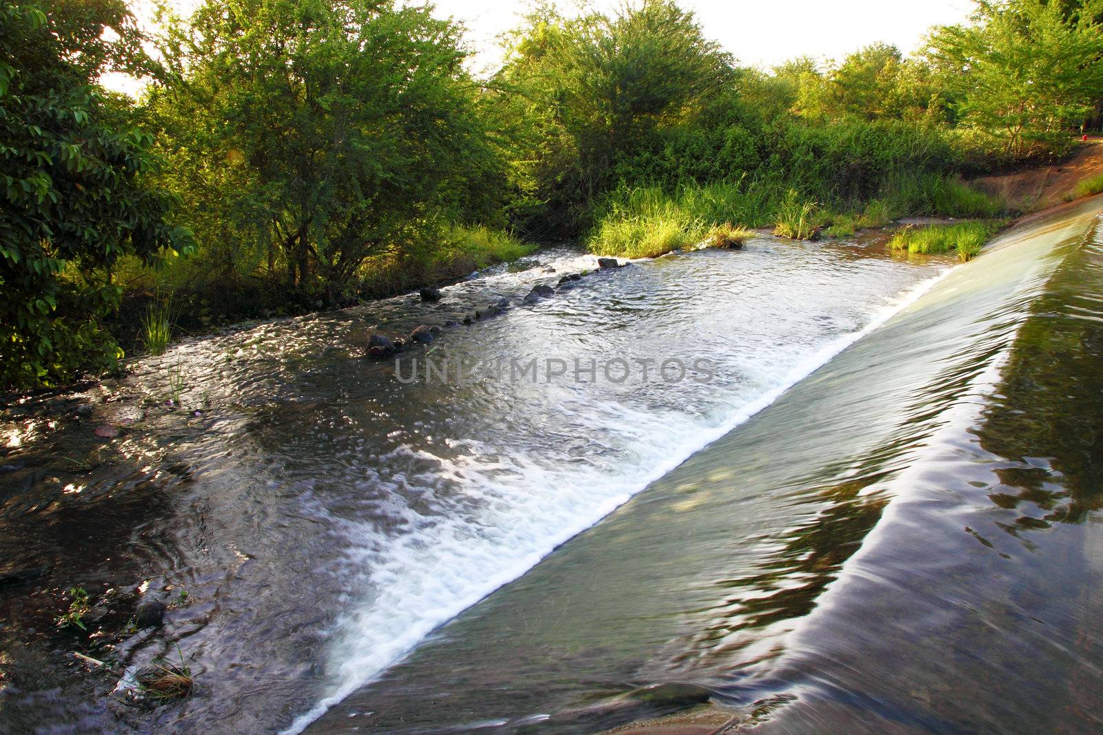 small dam in country side by geargodz