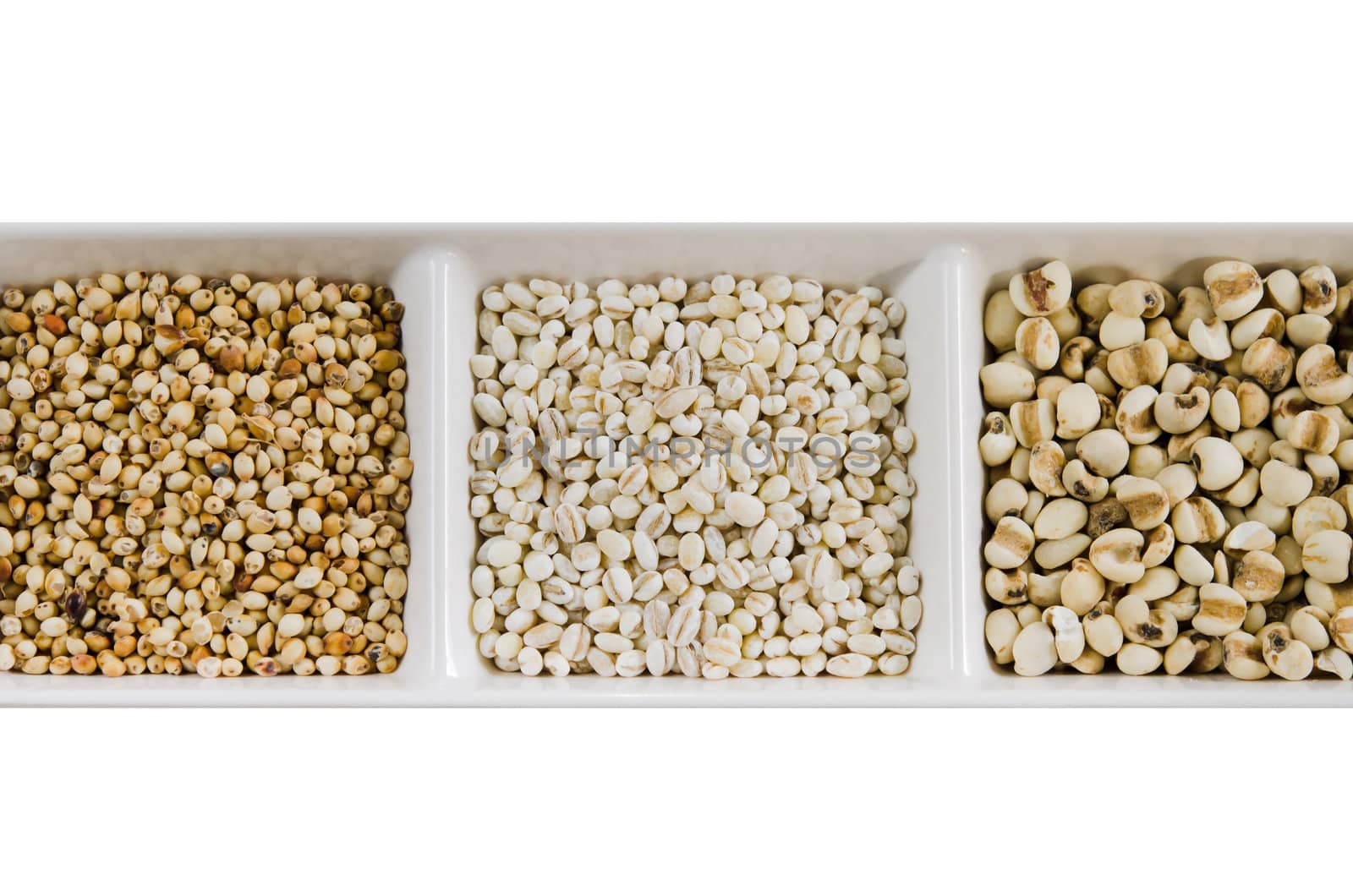  job's tears , barley and millet grains on white bowl
