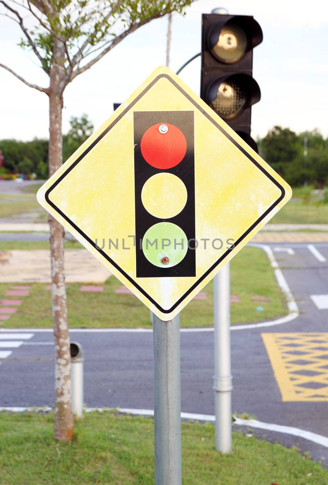 A road sign warning of a traffic light ahead by geargodz
