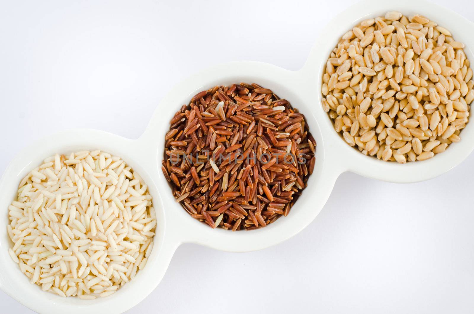 Grain and Cereal Set ,  rice , red rice , wheat over white bowl