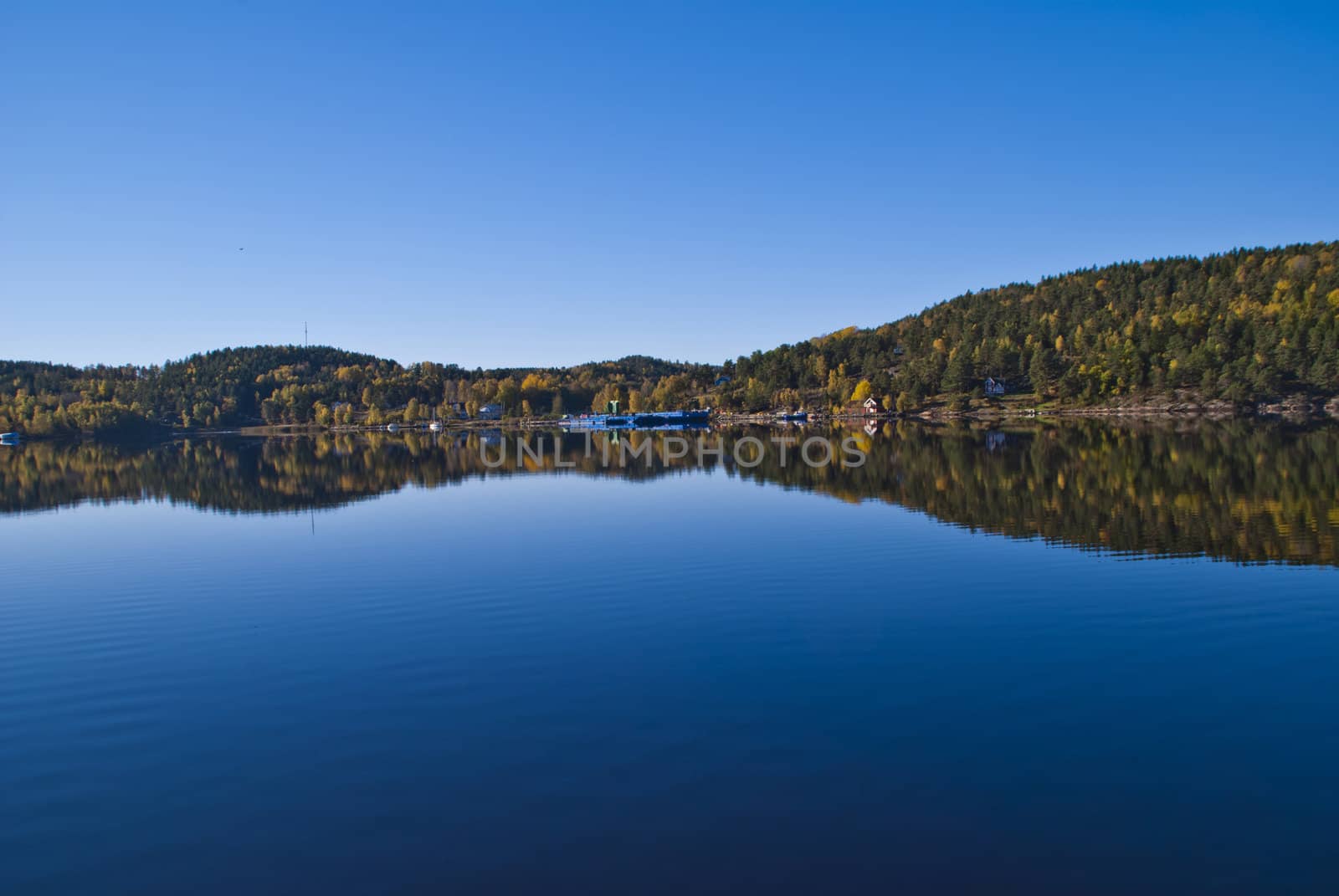 Image is shot by Iddefjord in Halden, Iddefjord borders both to Sweden and Norway