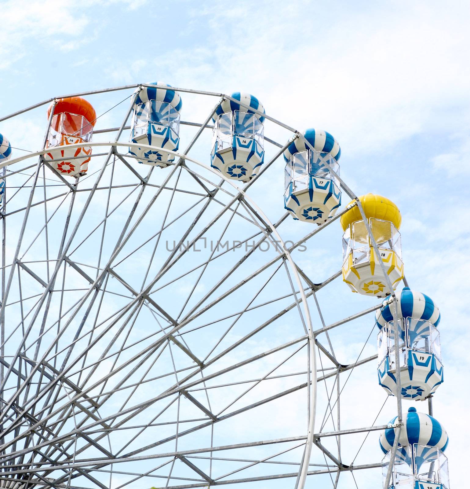 colored Ferris wheel with sky background