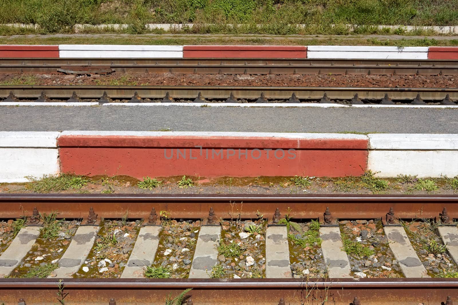 Fragment of railway tracks close up in sunny summer weather