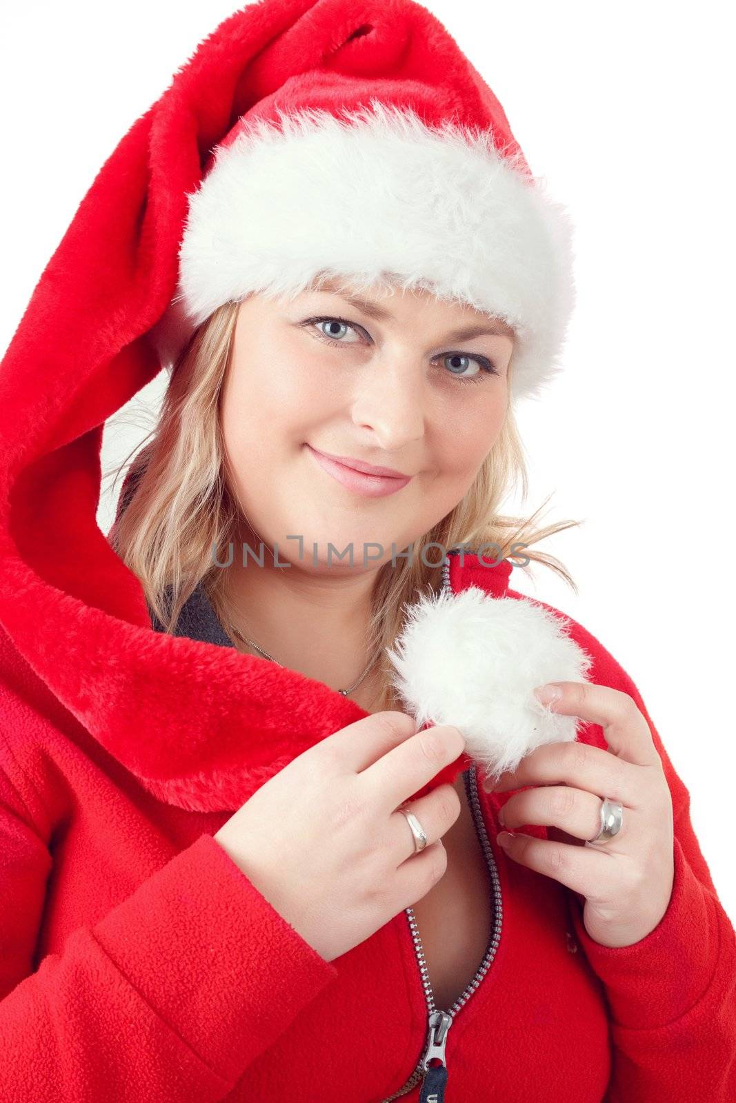 Portrait of joyful pretty woman in red santa claus hat smiling on white background
