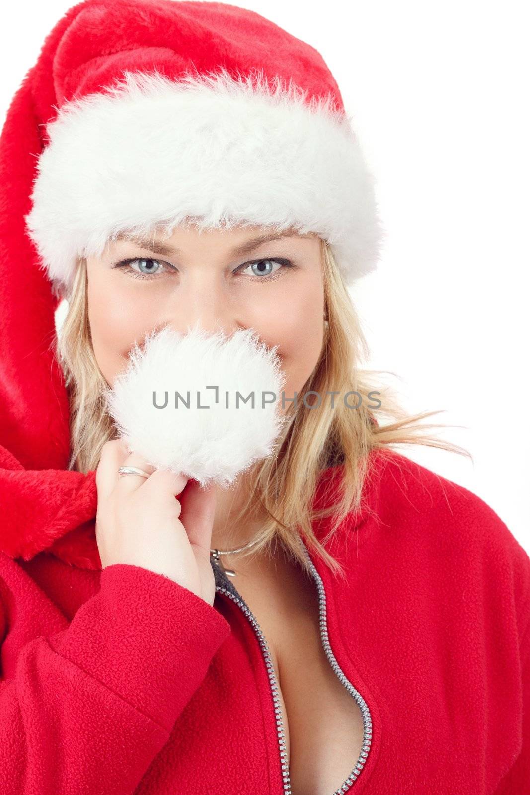 Portrait of joyful pretty woman in red santa claus hat smiling on white background