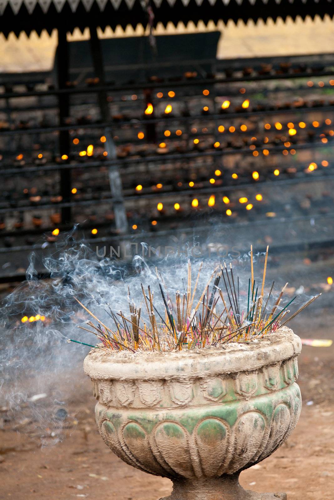 Burning incense sticks in a buddhist temple in Sri Lanka